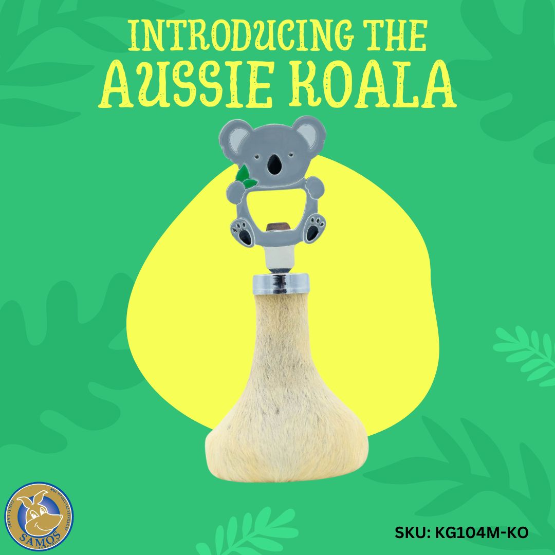 Gray koala rattle with natural sheepskin handle, front view on green background. - Yellow Earth Australia