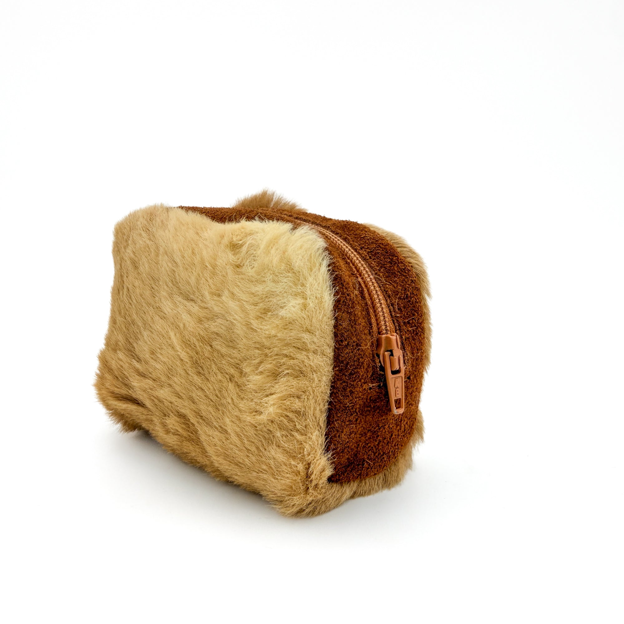 Kangaroo fur zip pouch, side view showing the zip pull and fur-to-leather panel