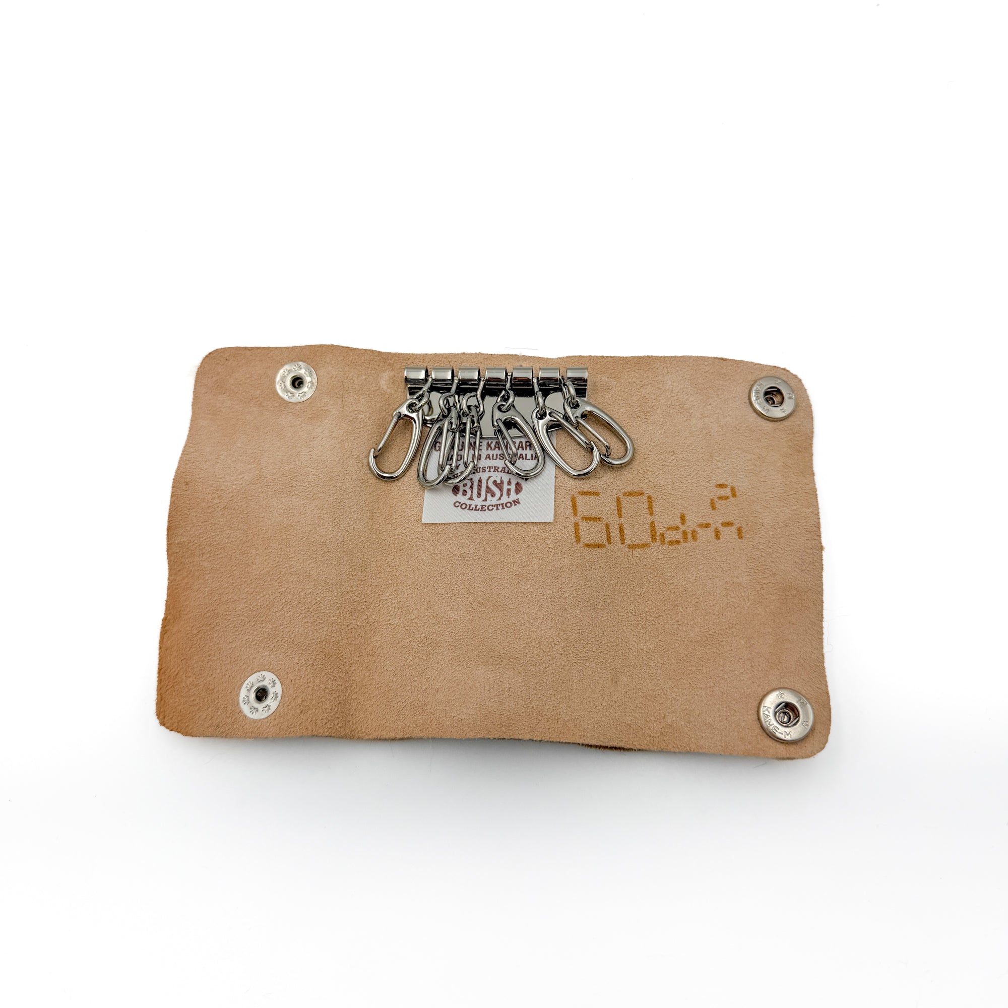 Kangaroo leather keycase open, showing 6 key hooks and the Australian Bush Collection tag