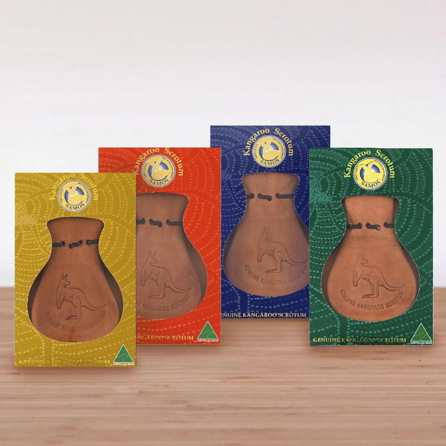 Four genuine leather kangaroo scrotum pouches in yellow, red, blue and green packaging displayed ... - Yellow Earth Australia