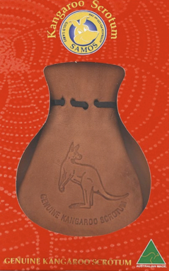 Brown leather kangaroo scrotum pouch displayed front view on red background. - Yellow Earth Australia