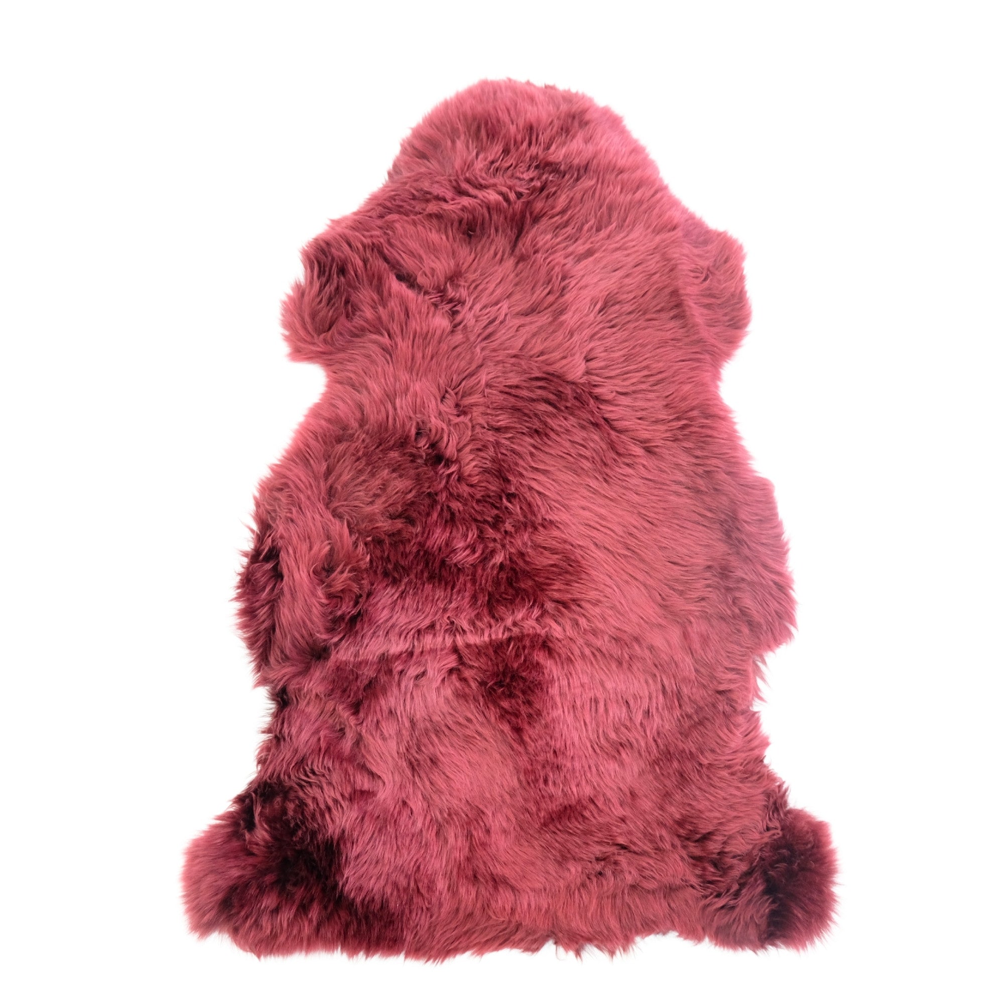 Pink sheepskin rug with fluffy wool texture viewed from above on white background. - Yellow Earth Australia