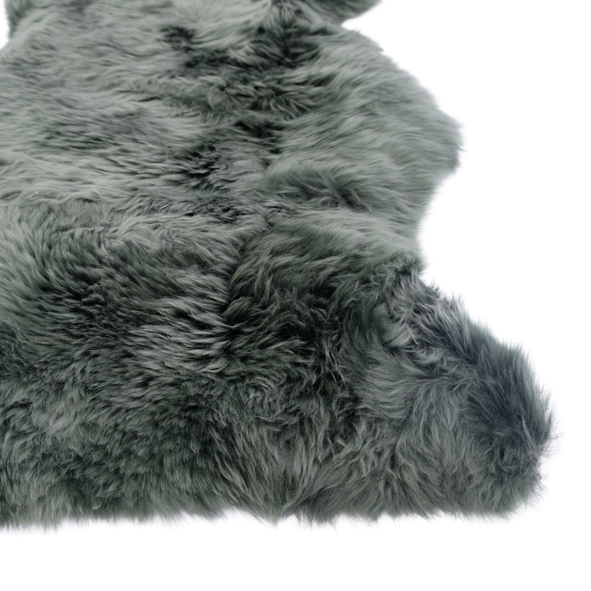 Gray sheepskin rug with thick woolly texture viewed from above on white background. - Yellow Earth Australia
