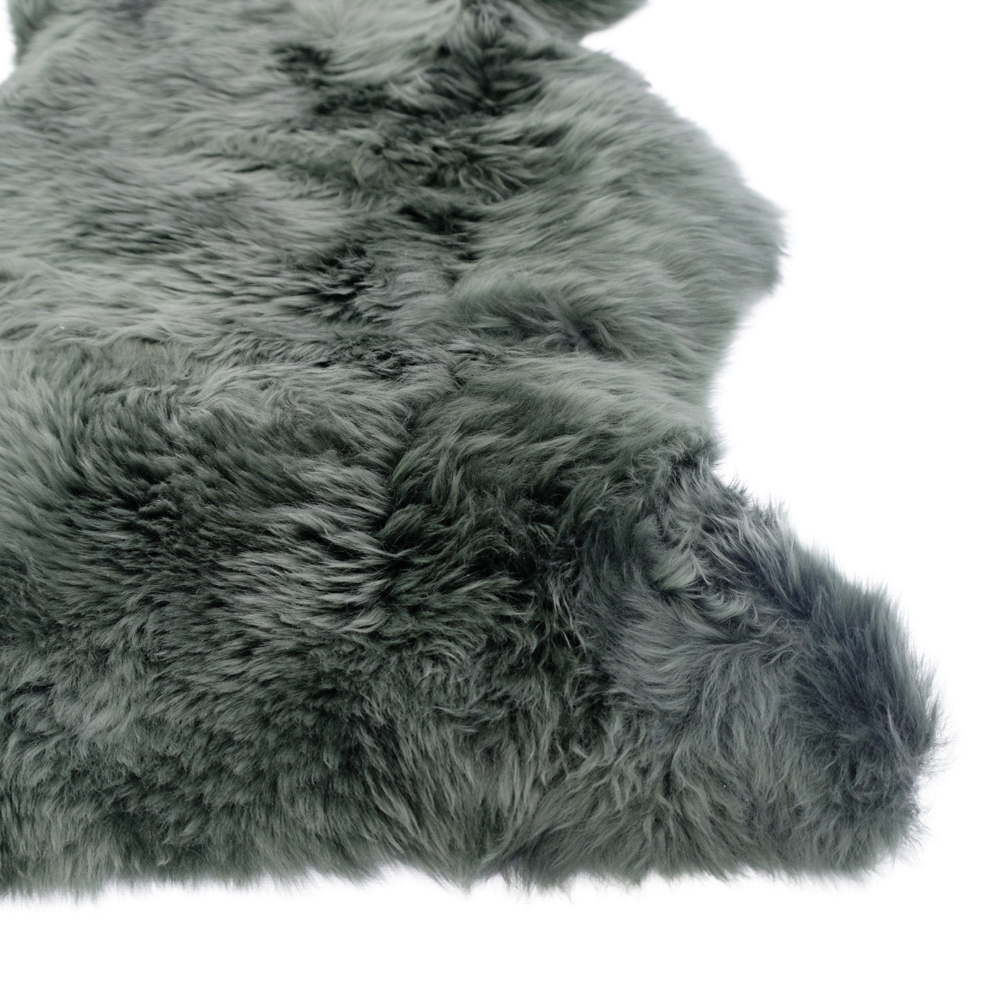 Gray sheepskin rug with thick woolly texture viewed from above on white background. - Yellow Earth Australia