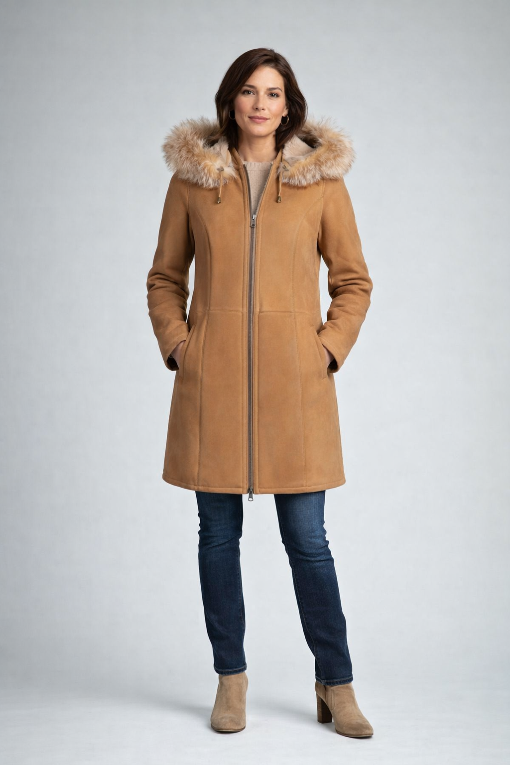 Camel wool coat with fur-lined hood, front view on model with dark jeans. - Yellow Earth Australia