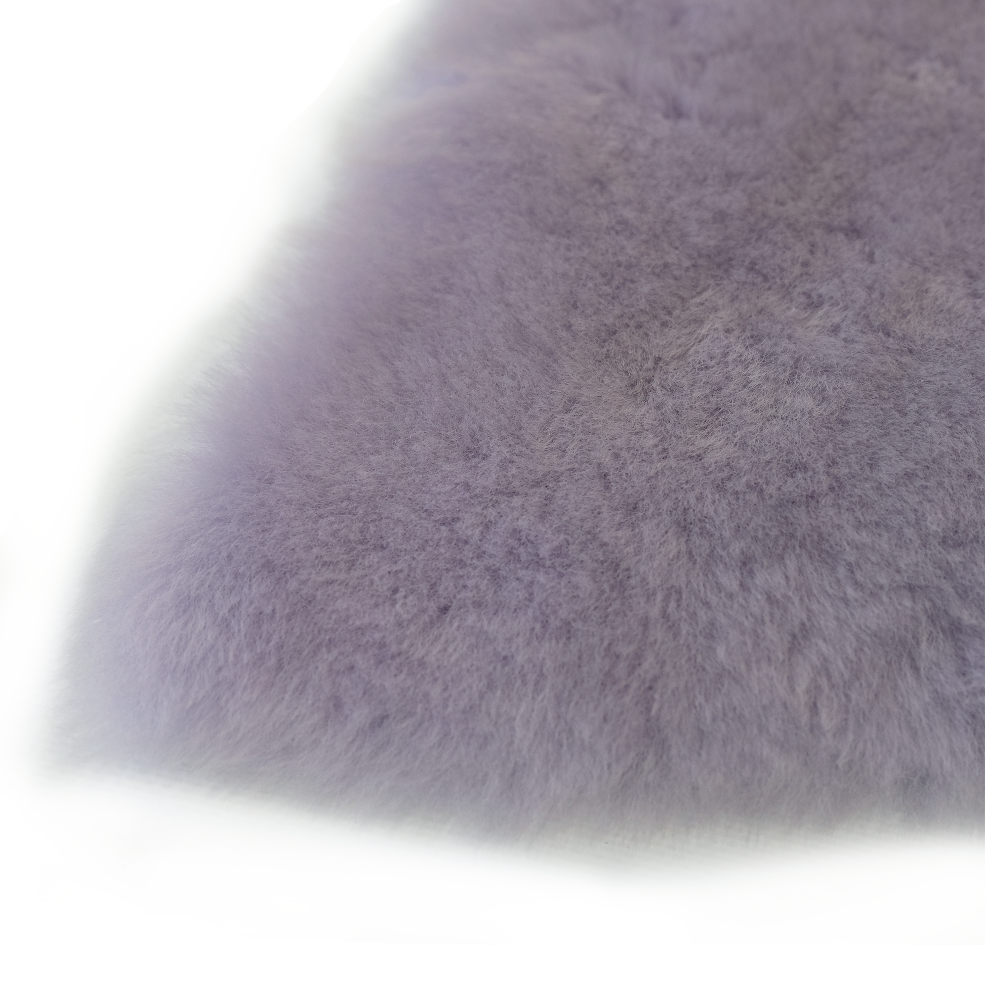 Soft grey sheepskin rug with fluffy wool texture, corner detail view. - Yellow Earth Australia