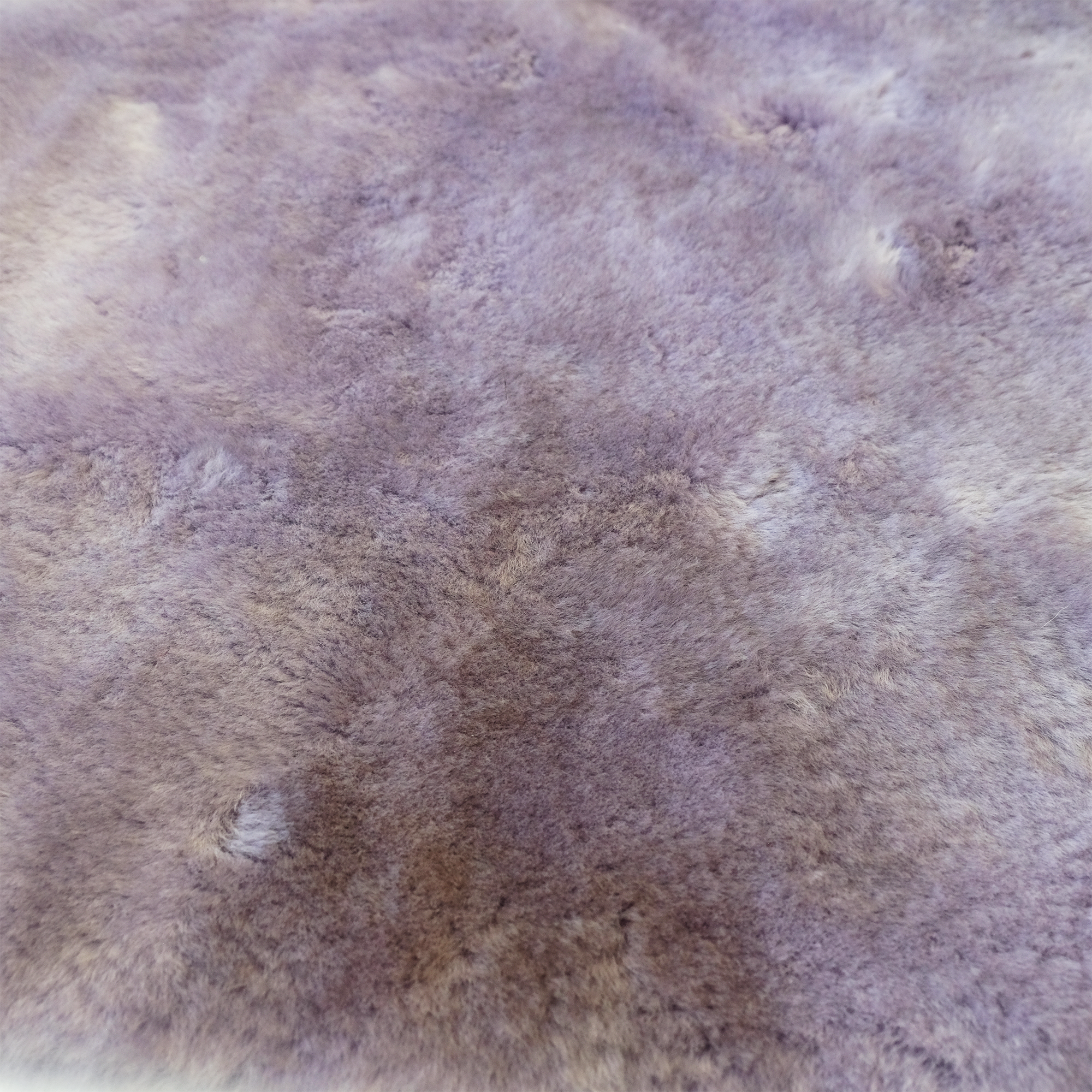 Soft purple sheepskin rug with luxurious wool pile texture viewed from above. - Yellow Earth Australia