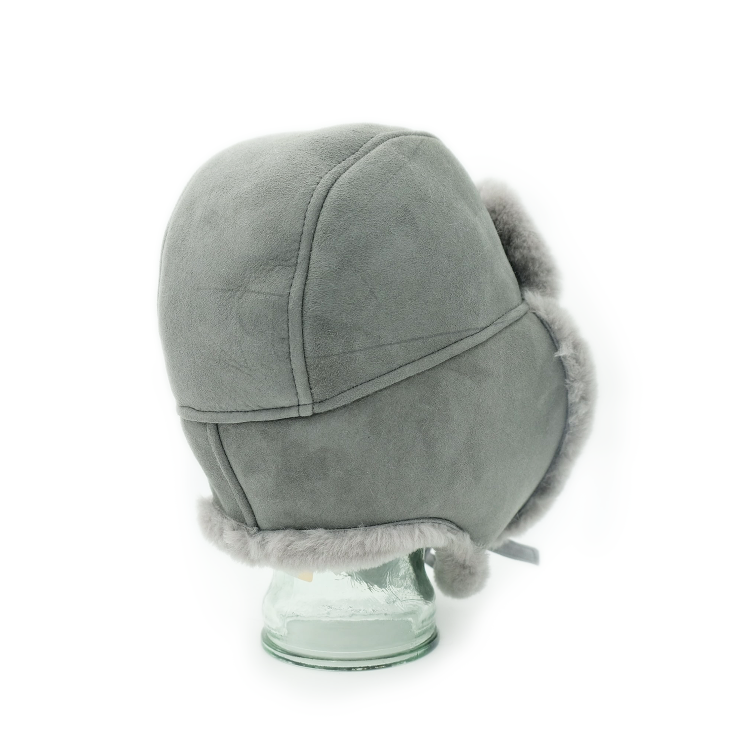 Grey sheepskin trapper hat with fuzzy ear flaps, back view on stand. - Yellow Earth Australia