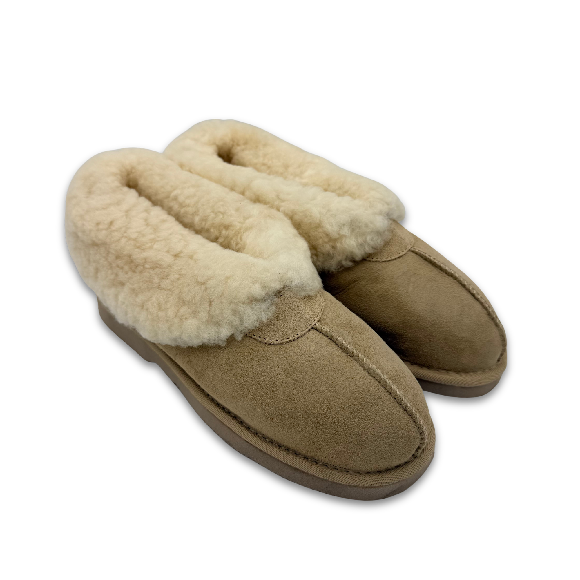 Pair of beige sheepskin slippers with wool lining, angled top view. - Yellow Earth Australia