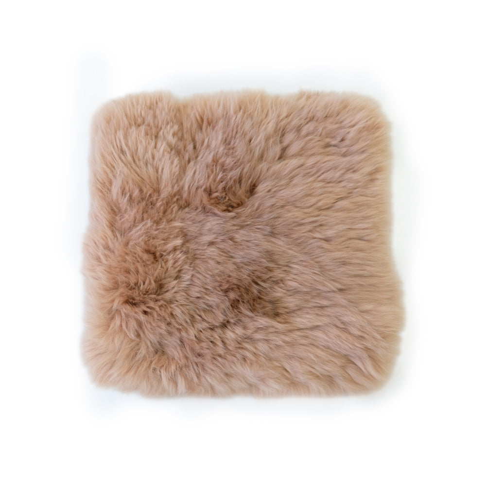 Beige sheepskin cushion cover with soft wool texture, top-down view. - Yellow Earth Australia