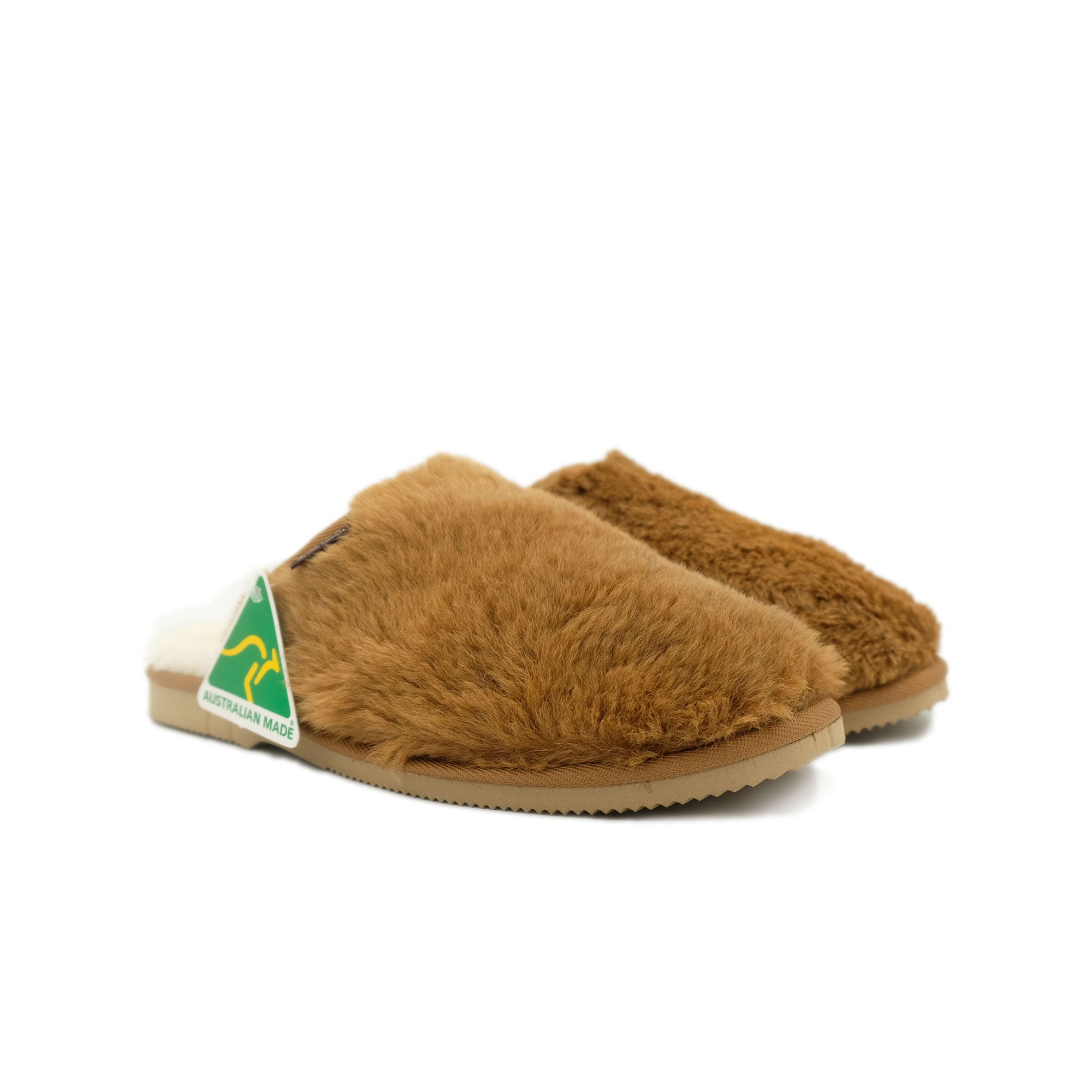 Pair of tan sheepskin slippers with fluffy wool lining, angled side view. - Yellow Earth Australia