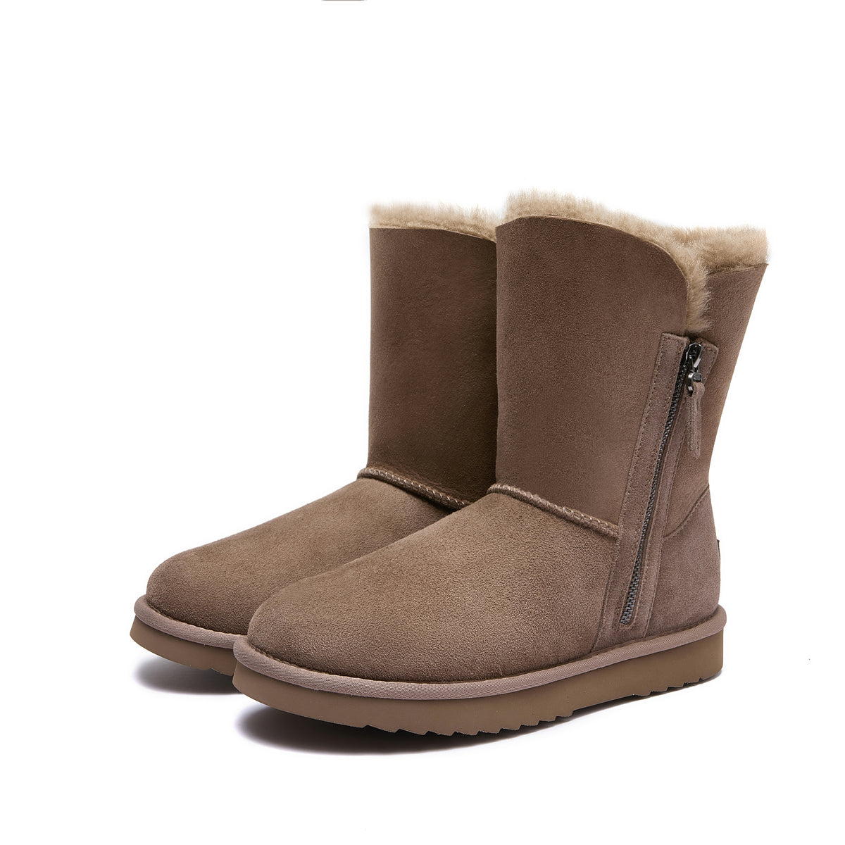 A pair of mid-calf brown suede boots with a soft cream-colored shearling lining visible at the top and a side zipper, shown against a plain white background.