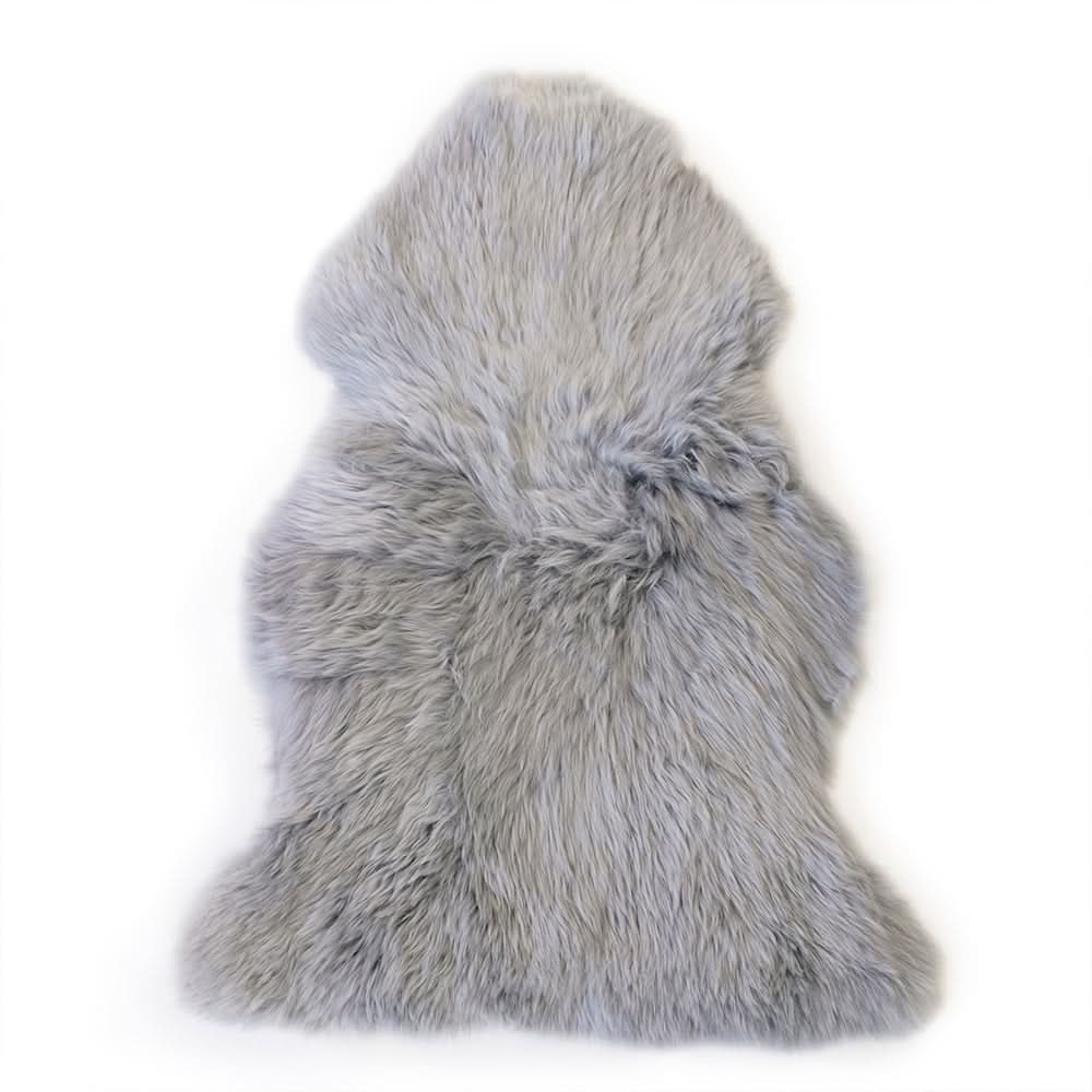 Grey sheepskin rug with soft wool pile, top-down view on white background. - Yellow Earth Australia