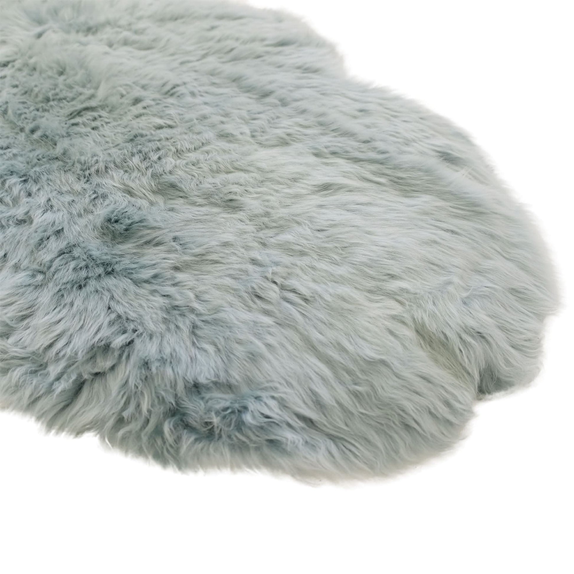 Soft grey sheepskin rug with fluffy wool texture, top-down view on white background. - Yellow Earth Australia