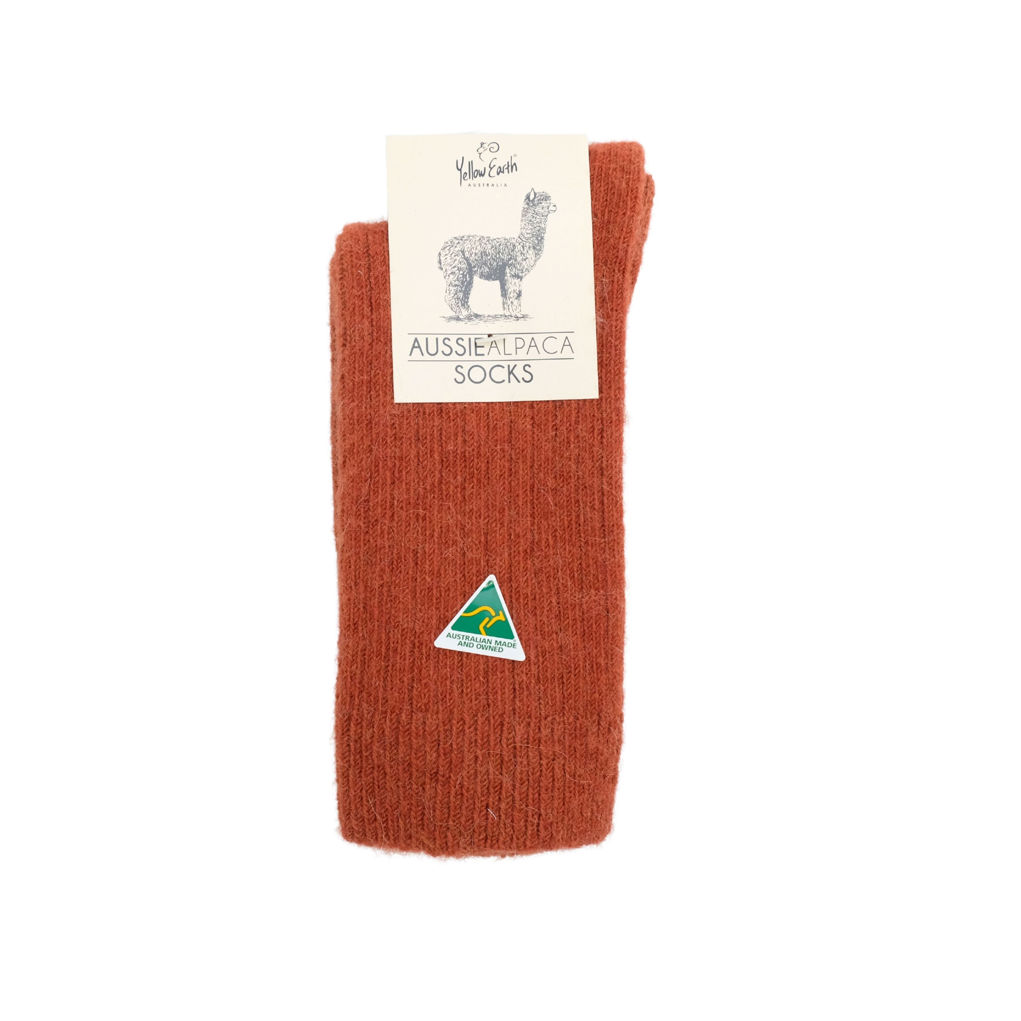 Rust-colored alpaca wool socks rolled and displayed from front view showing knit texture. - Yellow Earth Australia