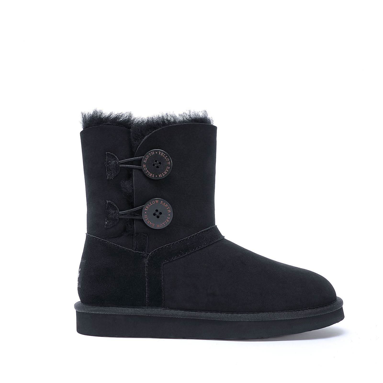Black suede sheepskin boot with fur lining and button detail, side view. - Yellow Earth Australia