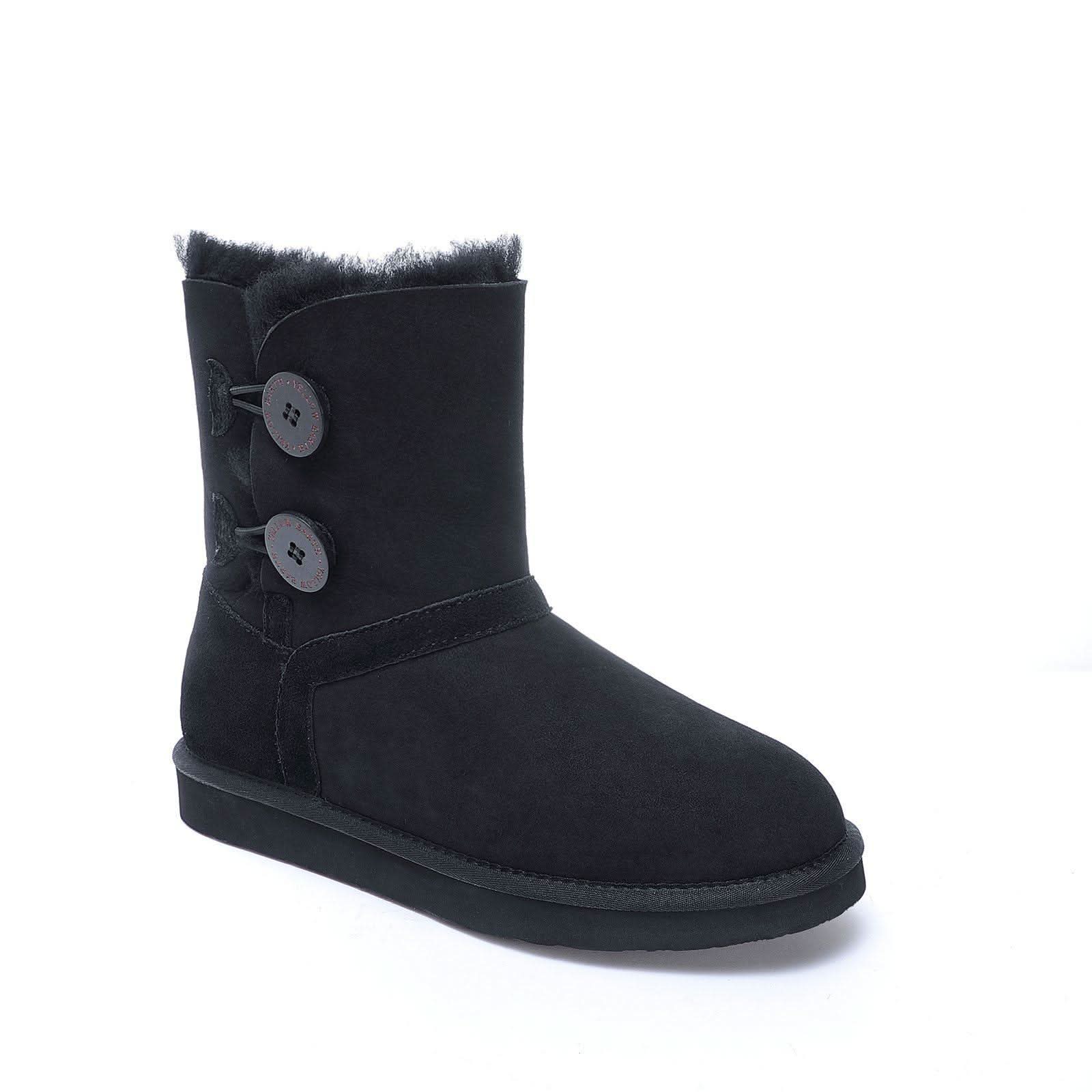 Black sheepskin mid-calf boot with button detail, side view. - Yellow Earth Australia