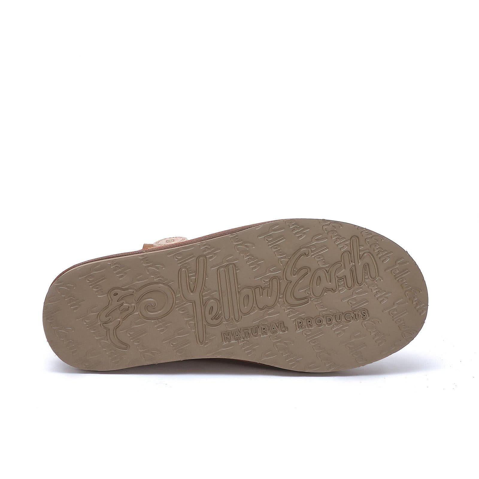 Tan sheepskin slipper sole showing natural products branding and tread pattern. - Yellow Earth Australia