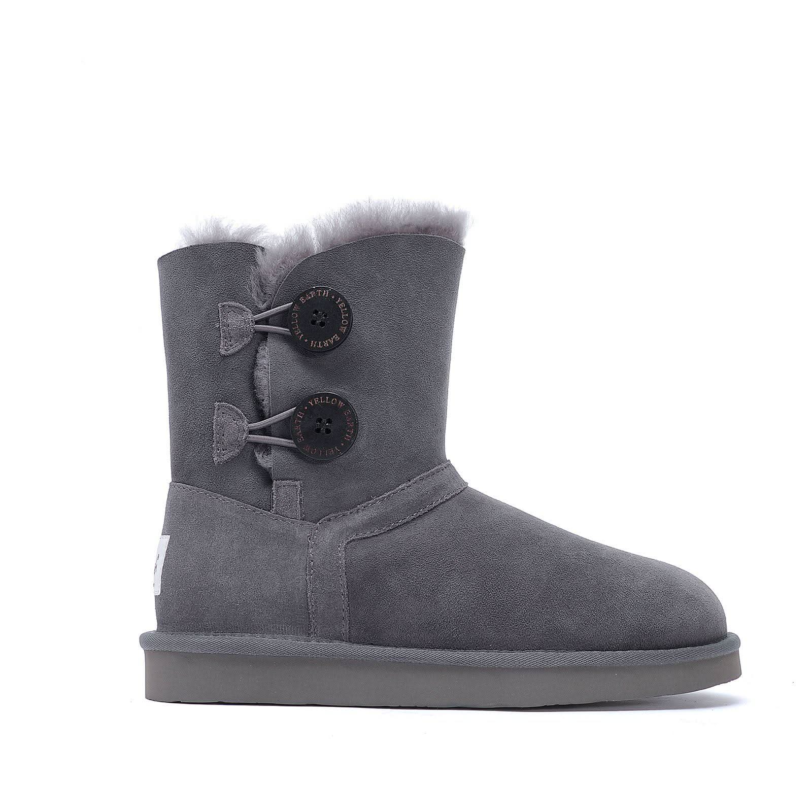 Grey sheepskin boot with fur lining and button detail, side view. - Yellow Earth Australia