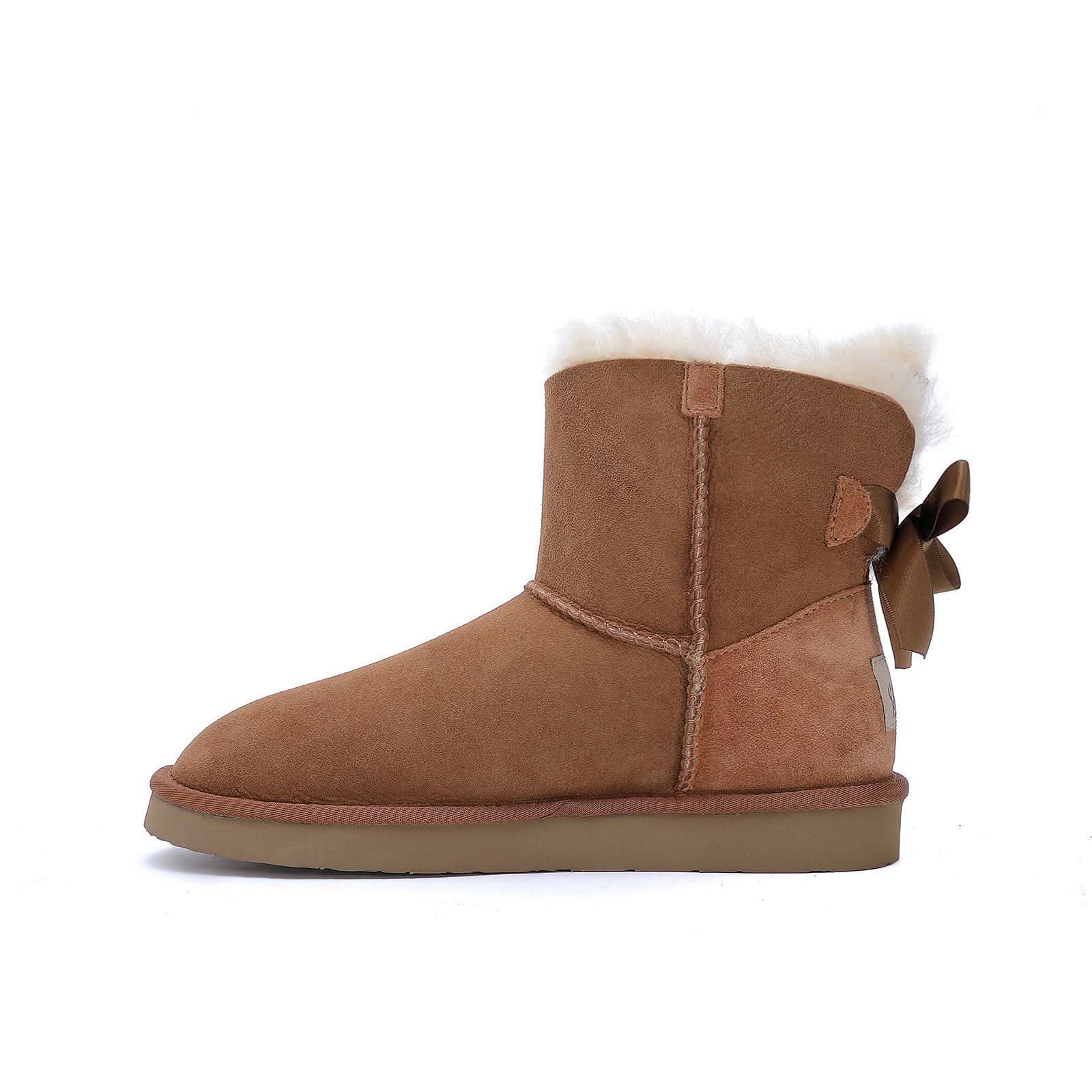 Chestnut suede sheepskin boot with white wool lining and bow detail, side view. - Yellow Earth Australia
