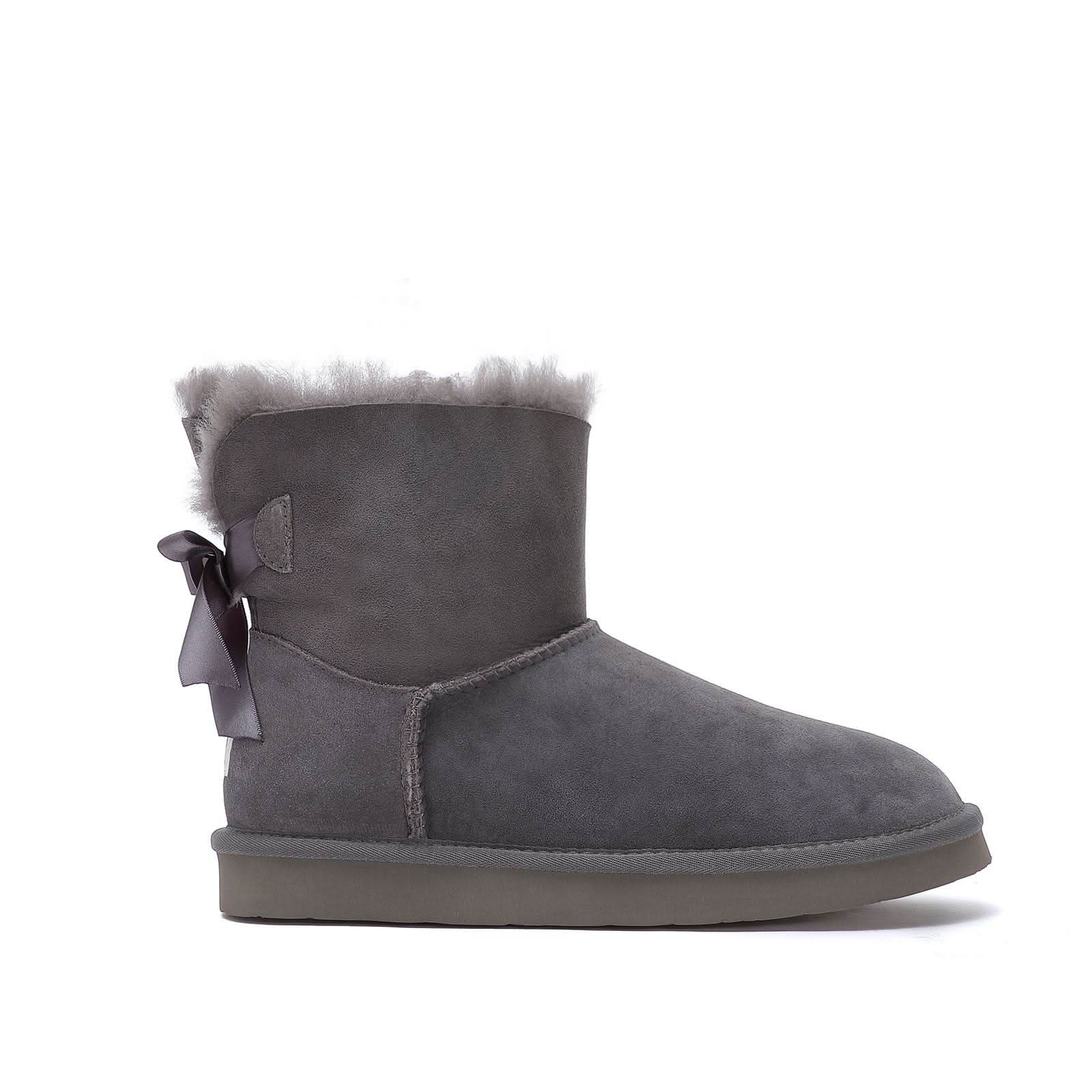Grey sheepskin ankle boot with fur trim and ribbon bow, side view. - Yellow Earth Australia