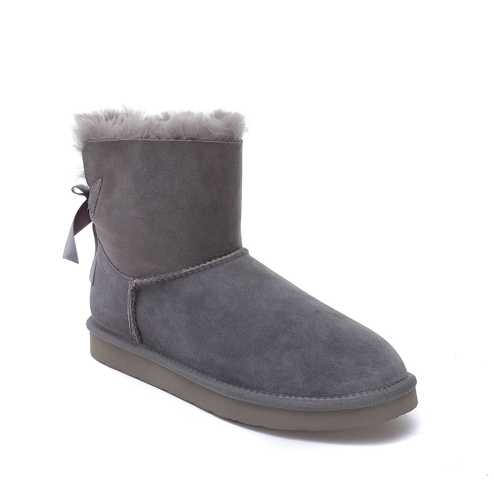 Grey suede sheepskin boot with fur collar and back bow, side view. - Yellow Earth Australia