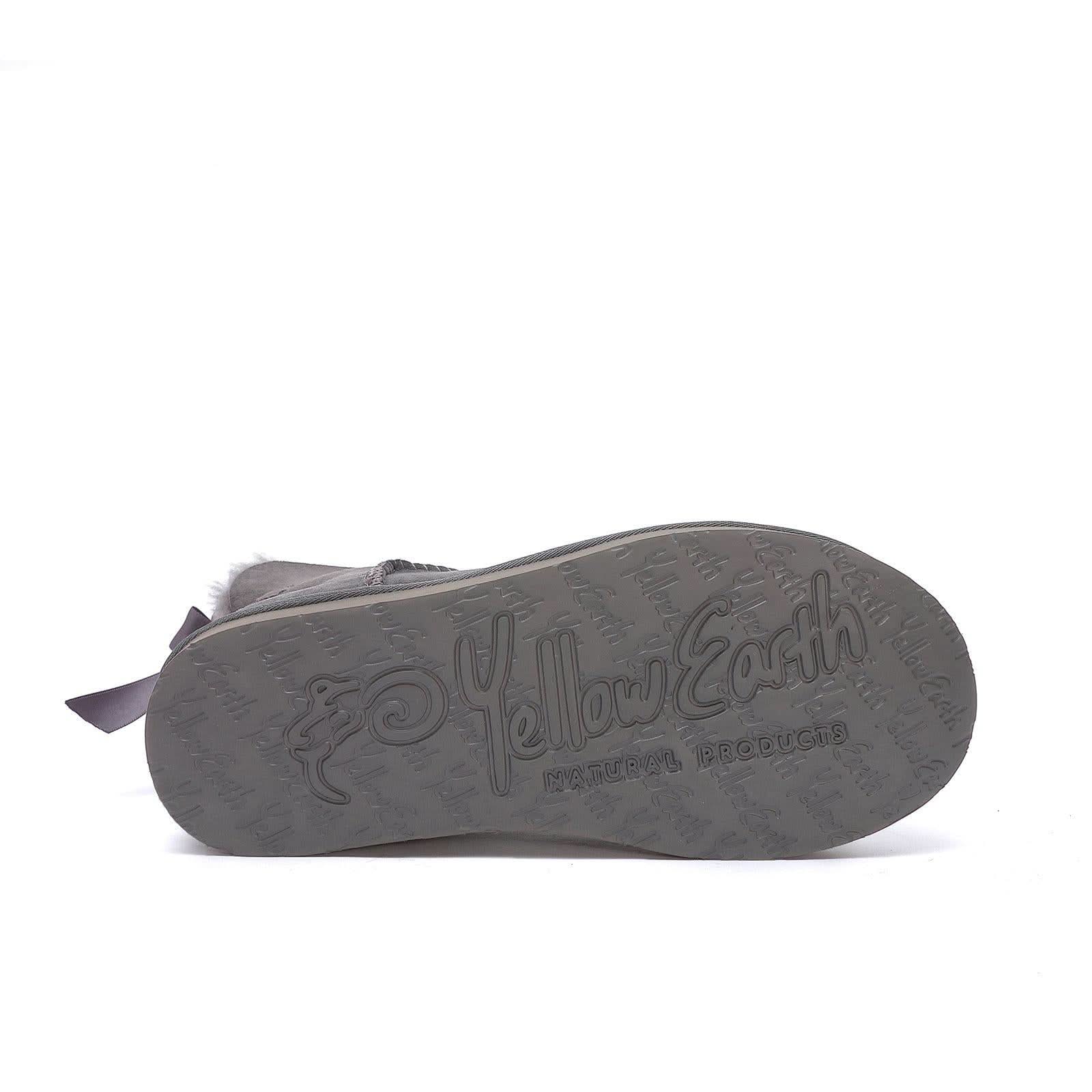 Grey sheepskin slipper sole view showing natural products branding on rubber outsole. - Yellow Earth Australia