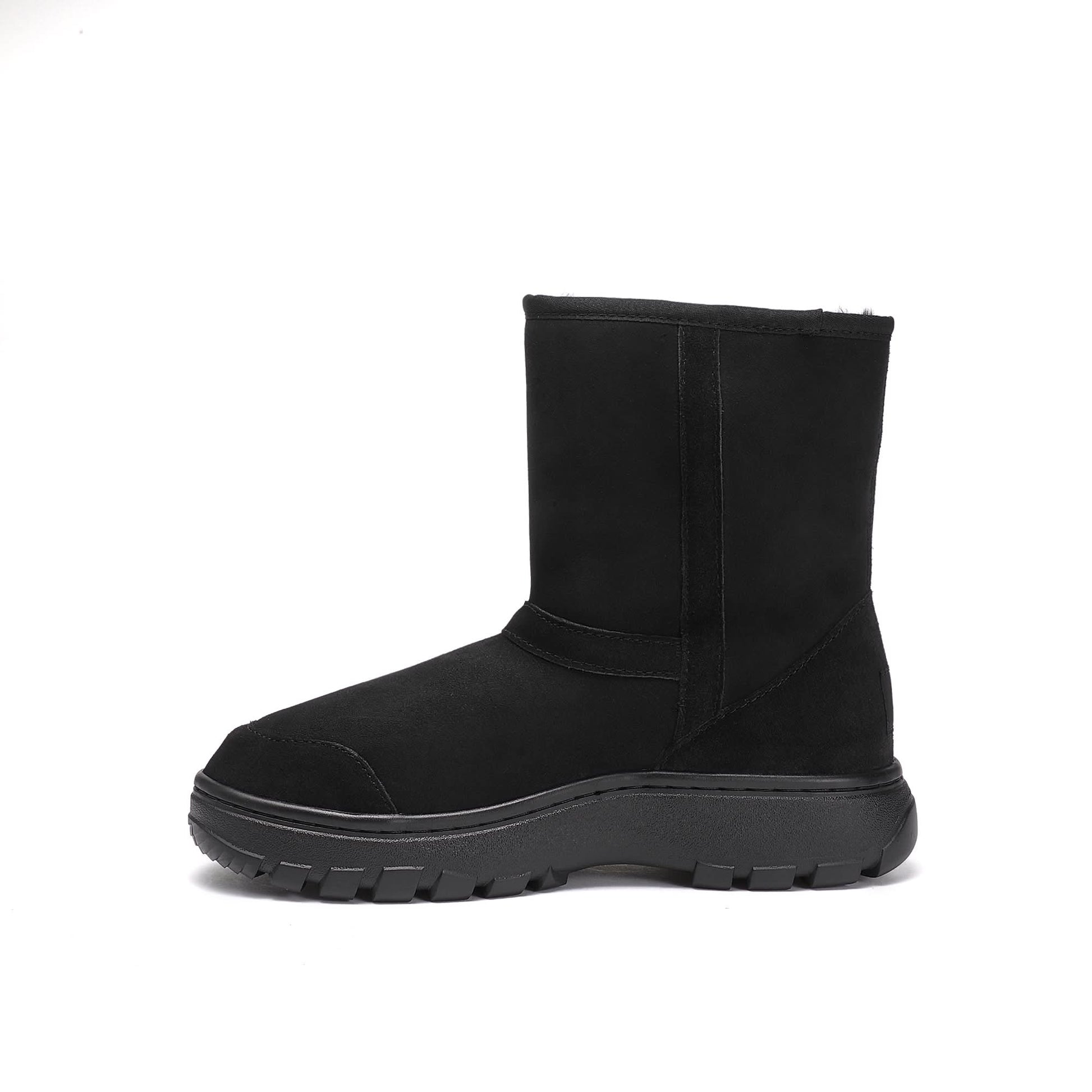 Black sheepskin mid-calf boot with chunky lug sole, side view. - Yellow Earth Australia
