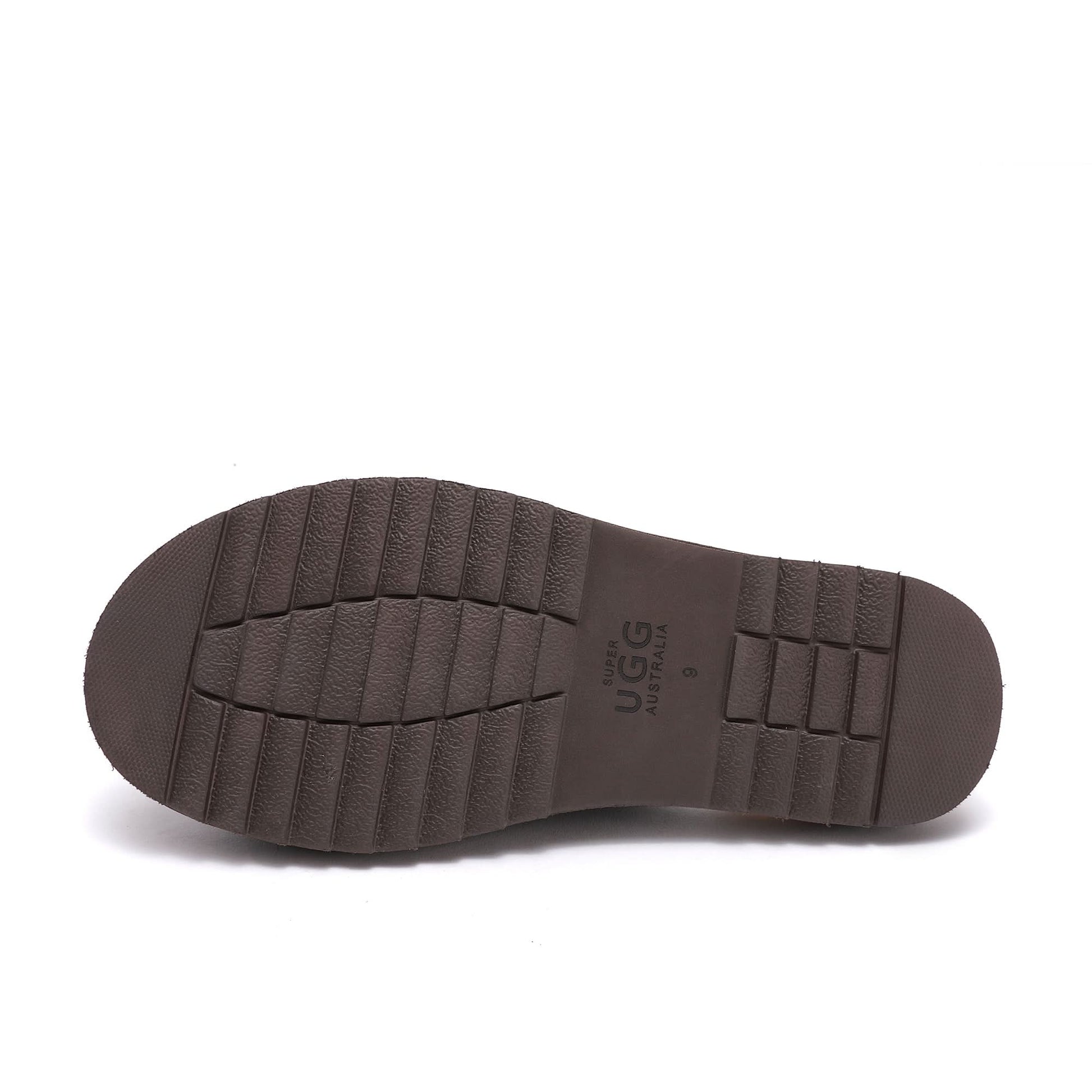 Brown sheepskin boot sole with textured grip pattern, bottom view. - Yellow Earth Australia