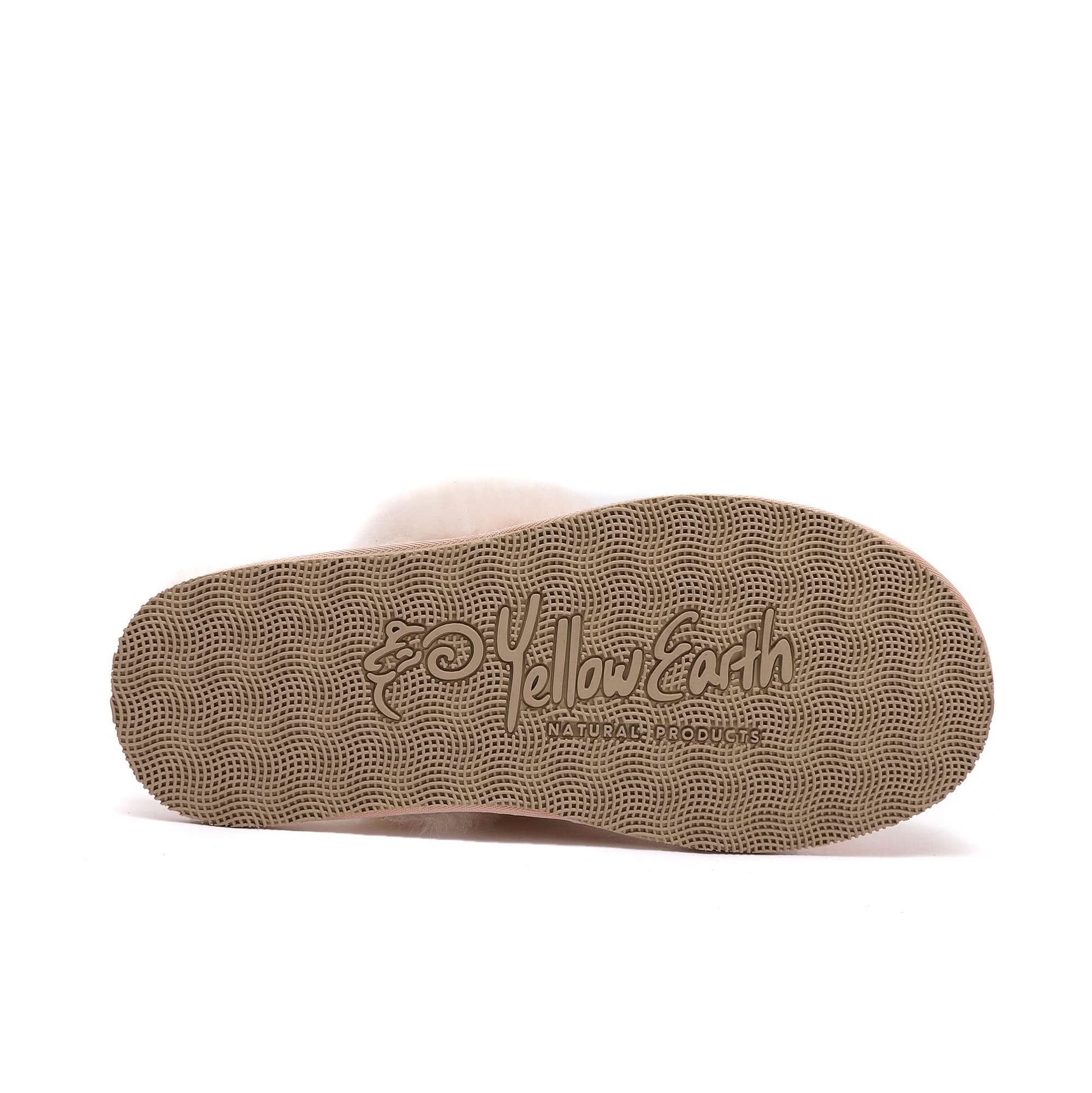 Beige sheepskin slipper sole with natural grip texture, bottom view. - Yellow Earth Australia