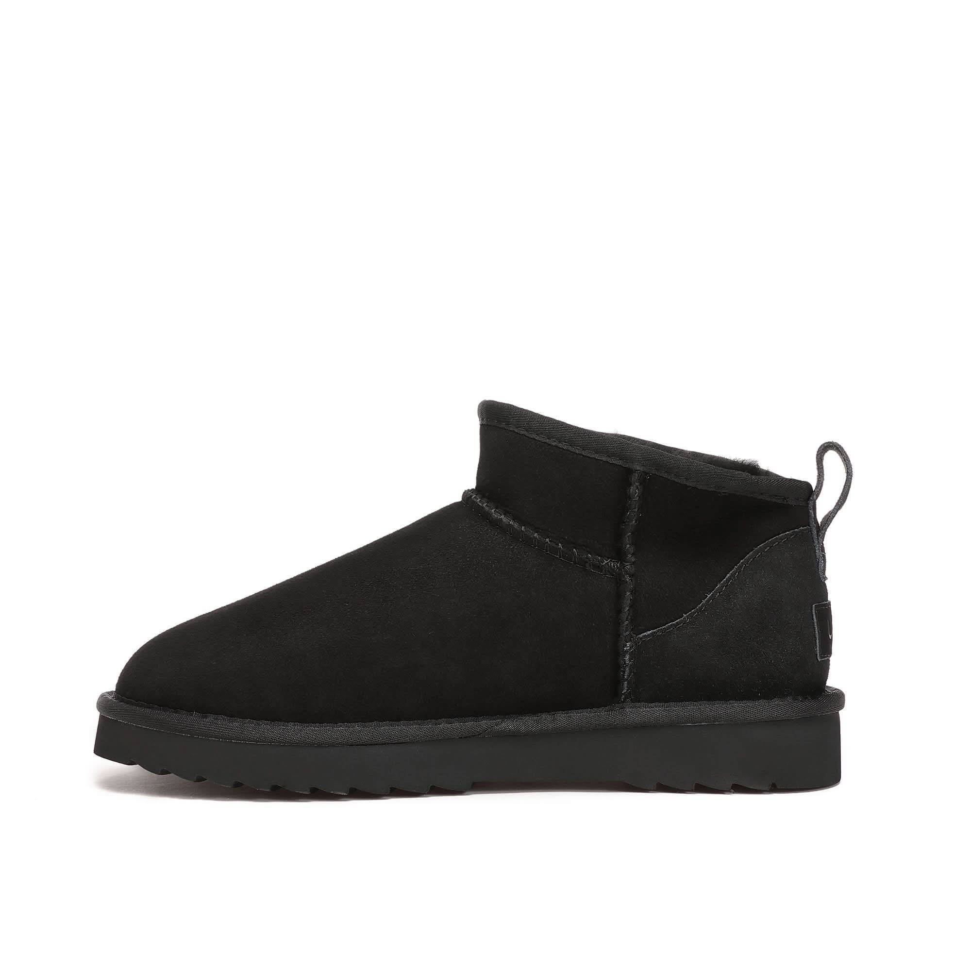 Black suede ankle boot with sheepskin lining, side view on white background. - Yellow Earth Australia