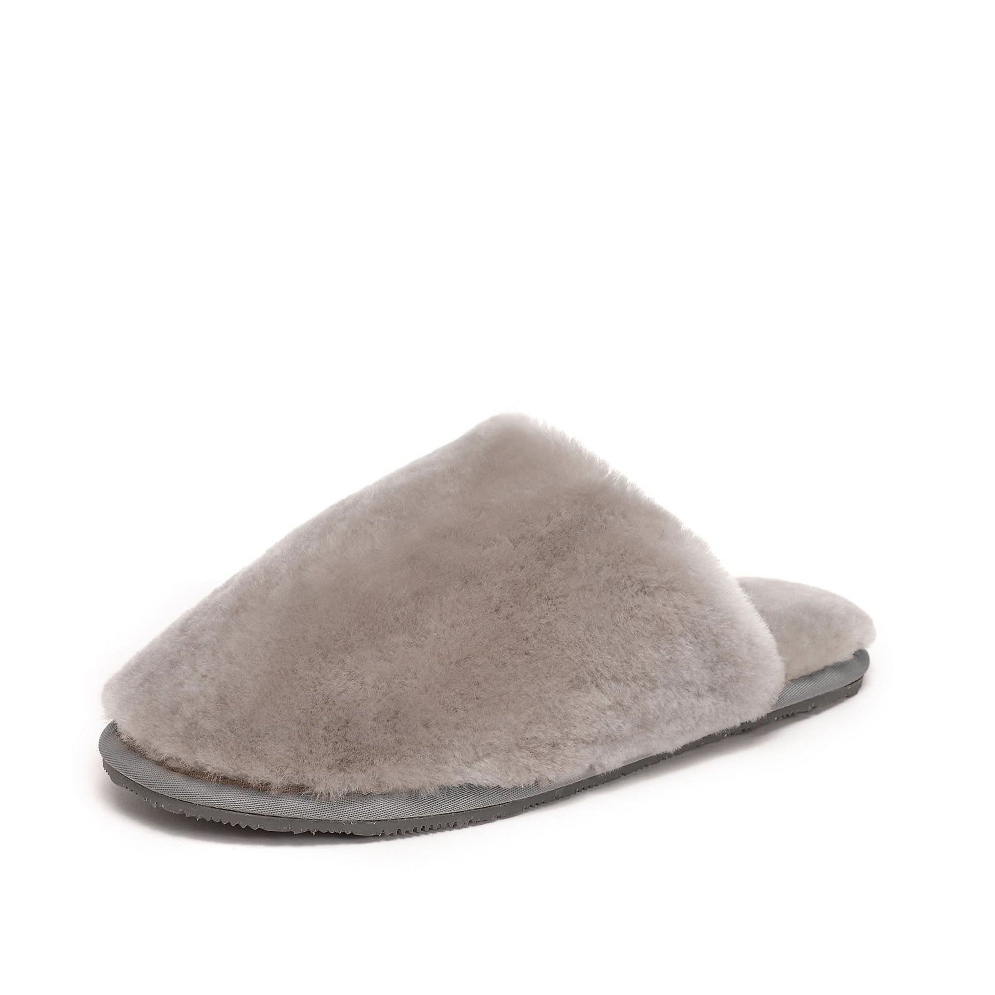 Grey sheepskin slipper with fluffy wool upper and dark sole, side view. - Yellow Earth Australia
