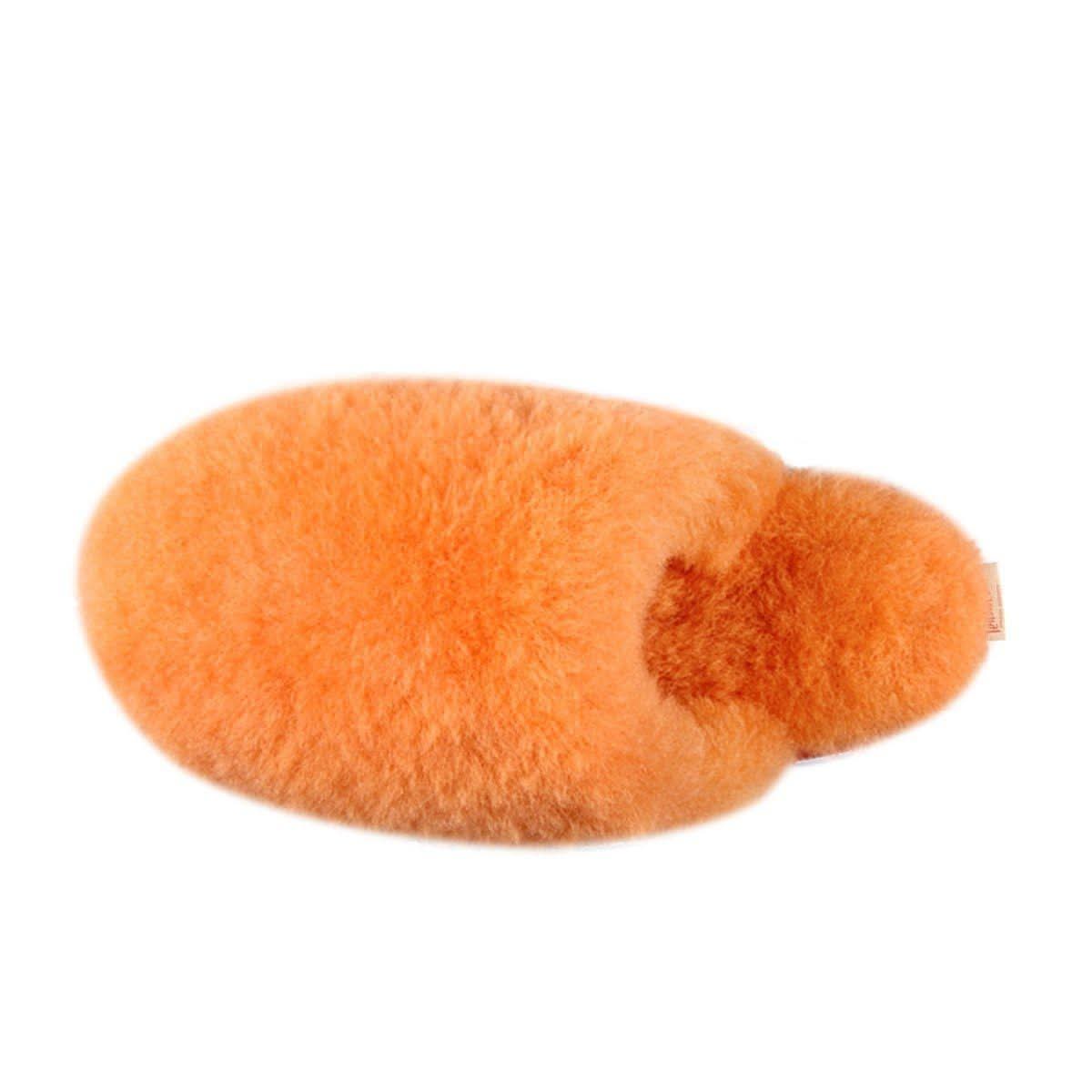 Soft orange sheepskin rug with fluffy wool texture, top view. - Yellow Earth Australia