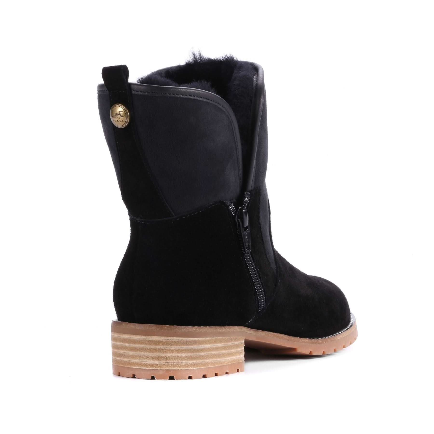 Black sheepskin wool mid-calf boot with tan lug sole, rear view. - Yellow Earth Australia