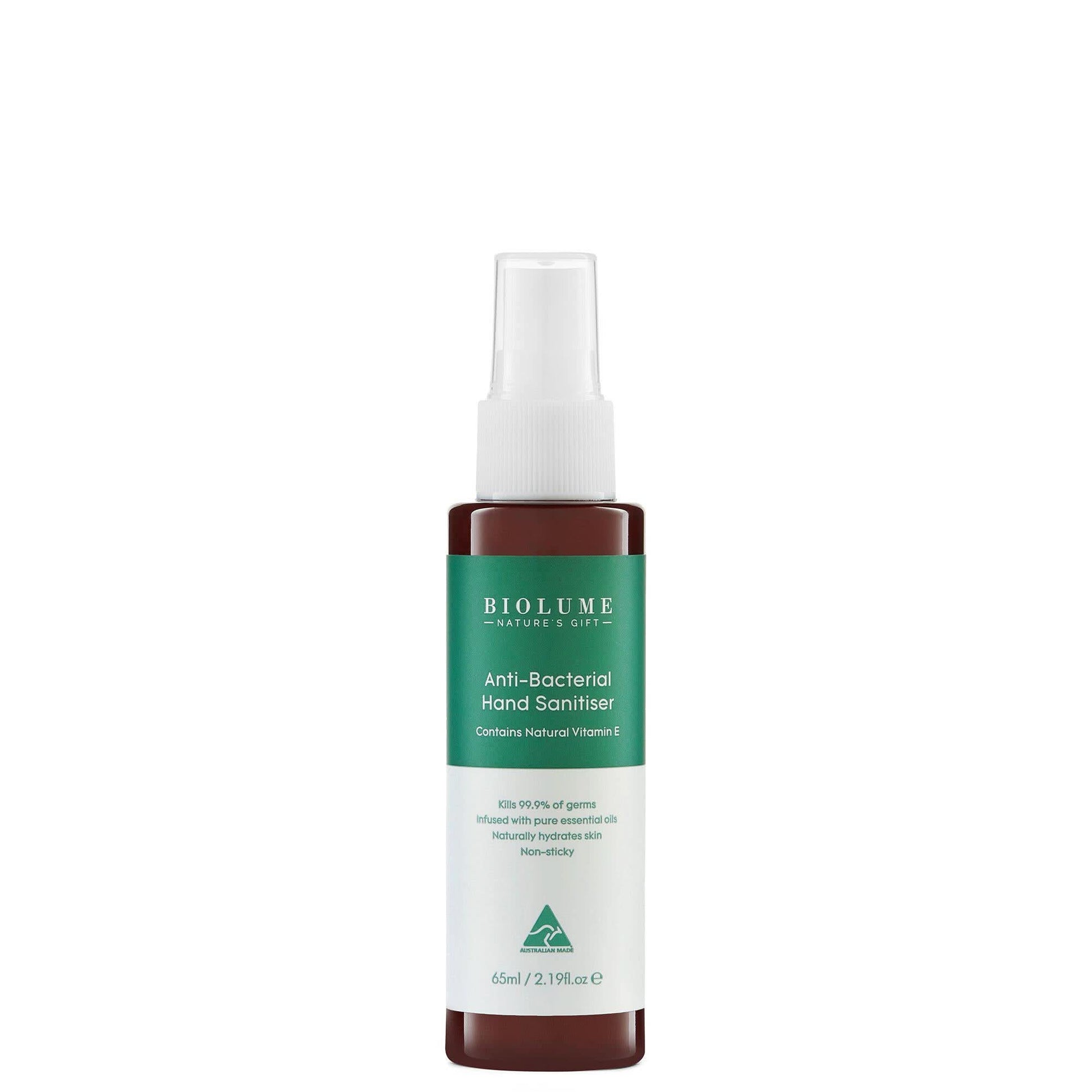 Brown glass spray bottle with green and white label containing hand sanitizer, front view. - Yellow Earth Australia