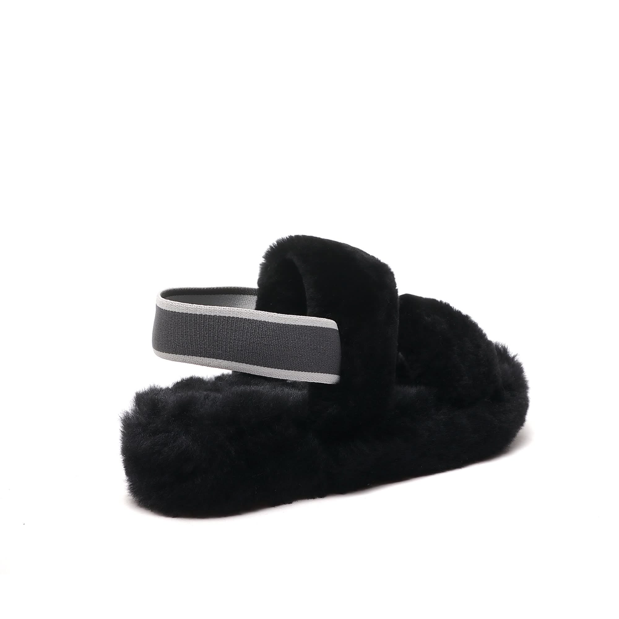 Black sheepskin slipper with grey elastic band, side view on white background. - Yellow Earth Australia