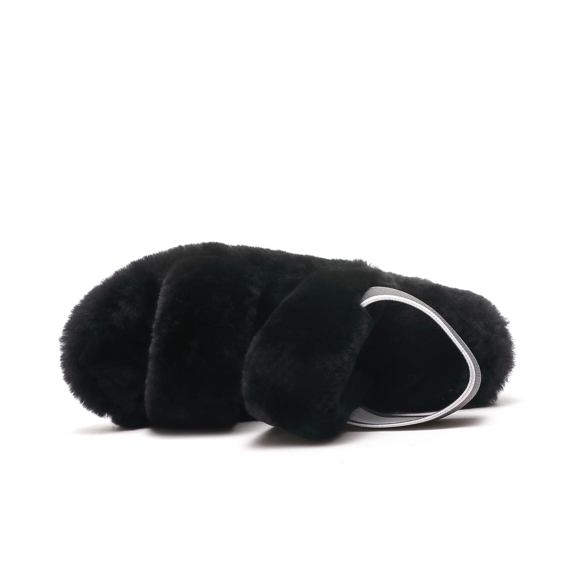 Black sheepskin clutch with soft wool exterior and silver handle, side view. - Yellow Earth Australia