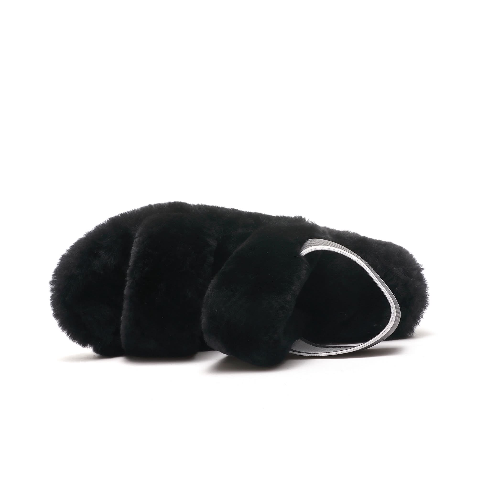 Black sheepskin clutch with soft wool exterior and silver handle, side view. - Yellow Earth Australia