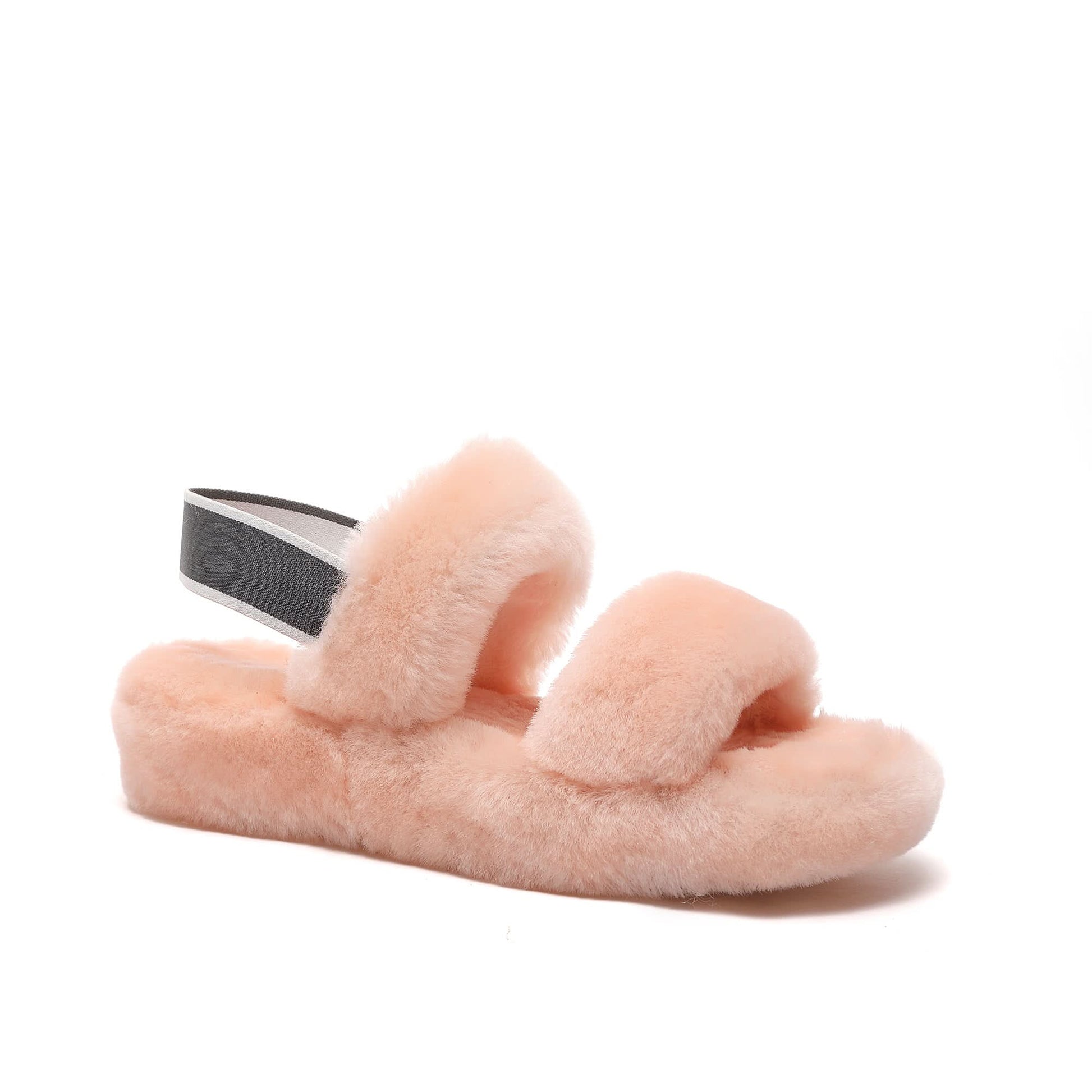 Soft pink fluffy sheepskin slider sandal with black strap, side view. - Yellow Earth Australia