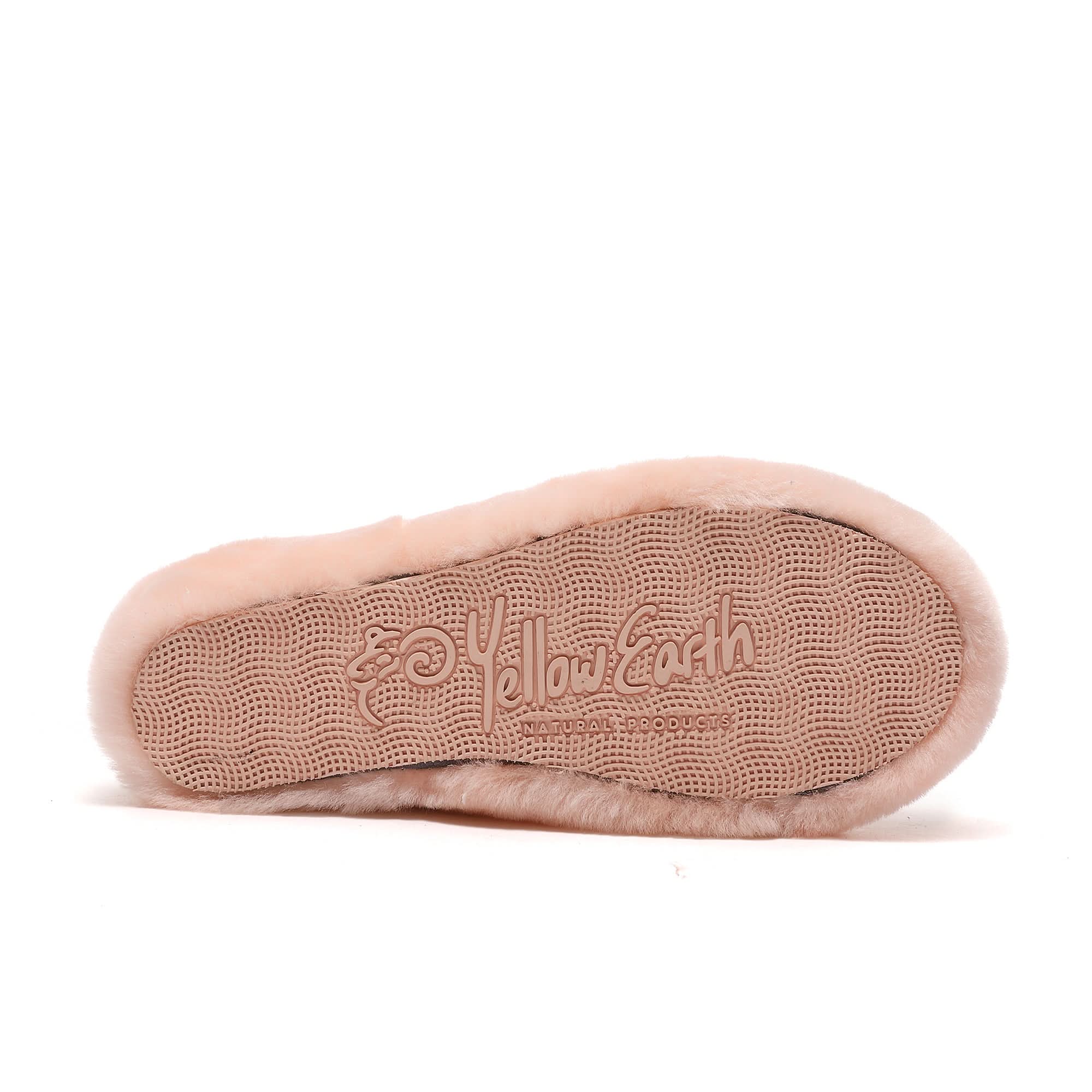 Soft pink sheepskin slipper sole with textured grip pattern, bottom view. - Yellow Earth Australia