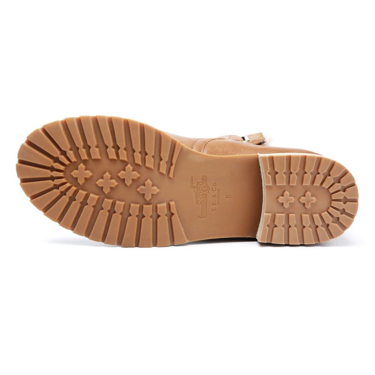 Tan suede and sheepskin ankle boot sole view showing textured rubber tread pattern. - Yellow Earth Australia