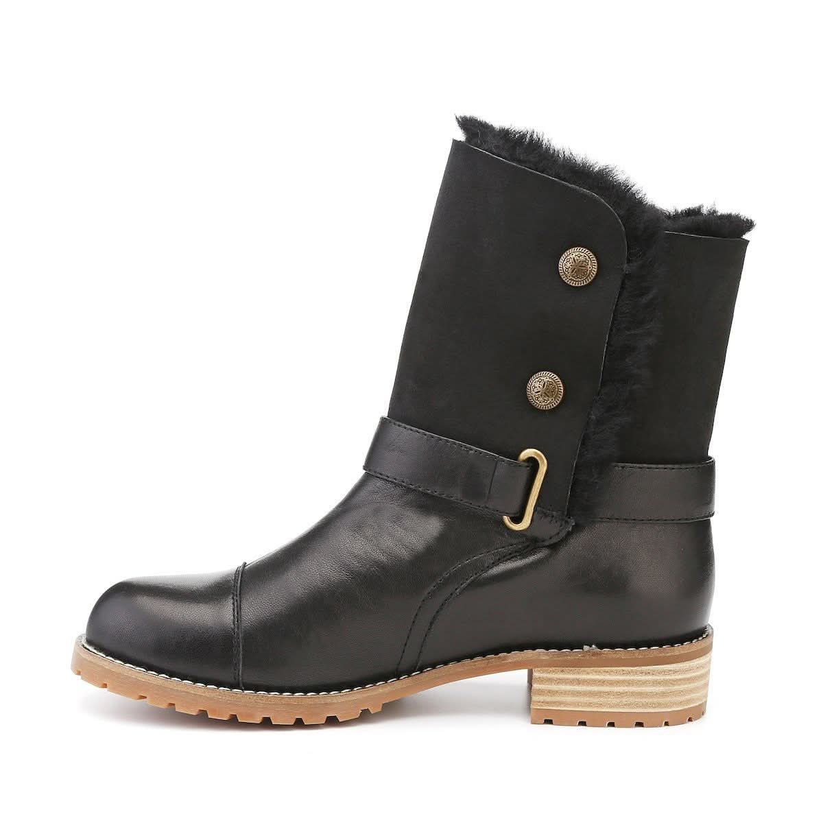 Black sheepskin mid-calf boot with fur lining and tan rubber sole, side view. - Yellow Earth Australia