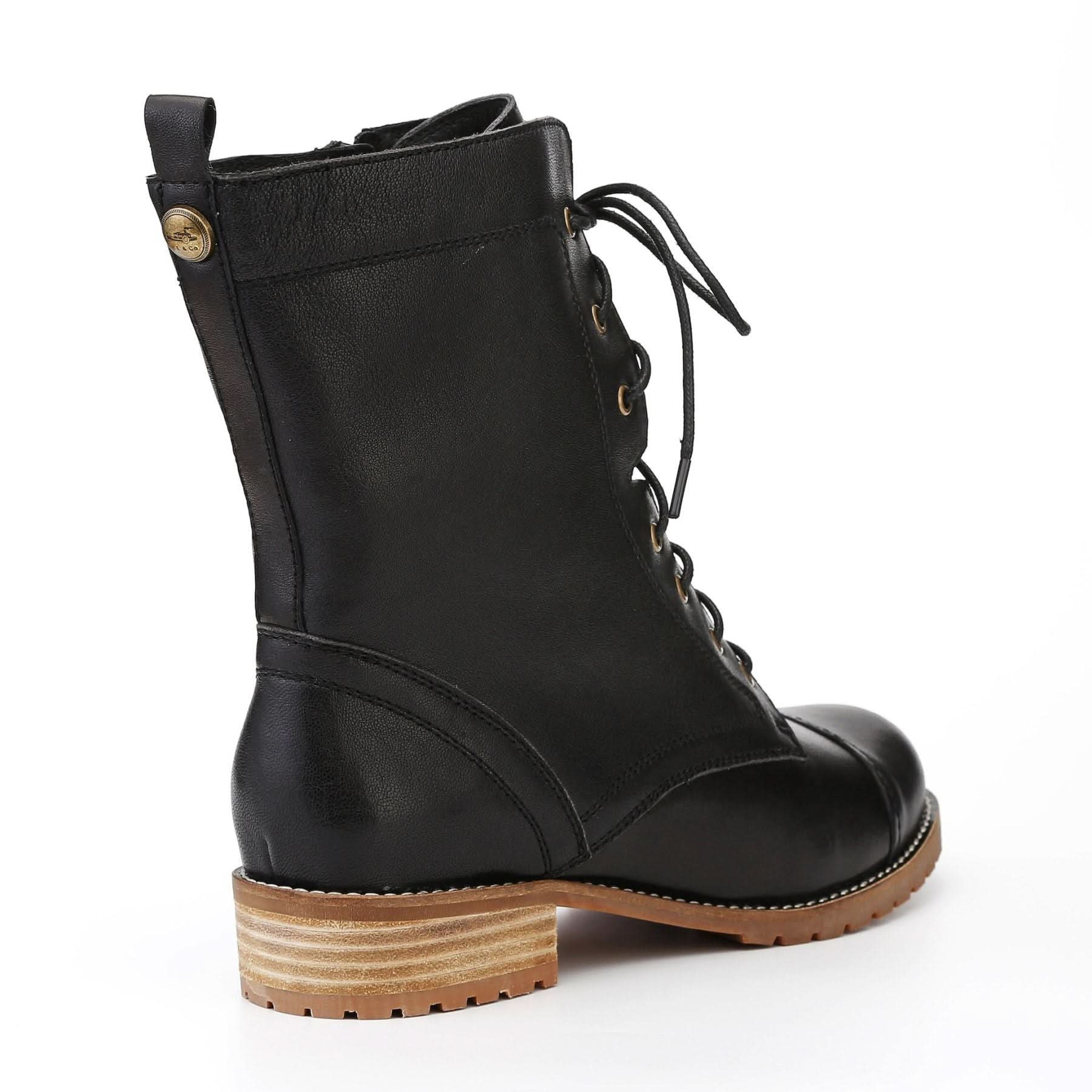Black leather lace-up boot with tan lugged sole, rear three-quarter view. - Yellow Earth Australia