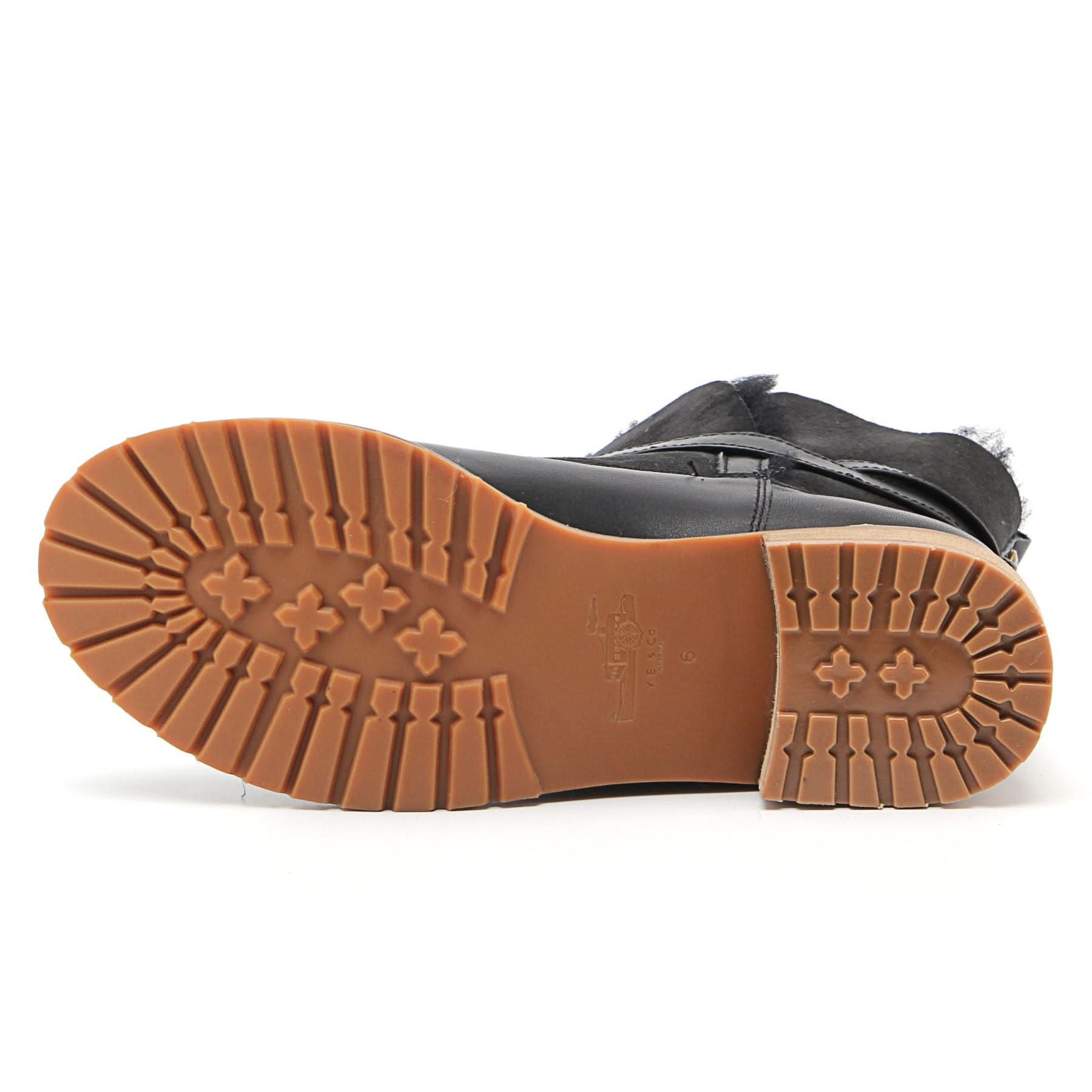 Black sheepskin boot with tan rubber sole shown from underneath sole view. - Yellow Earth Australia