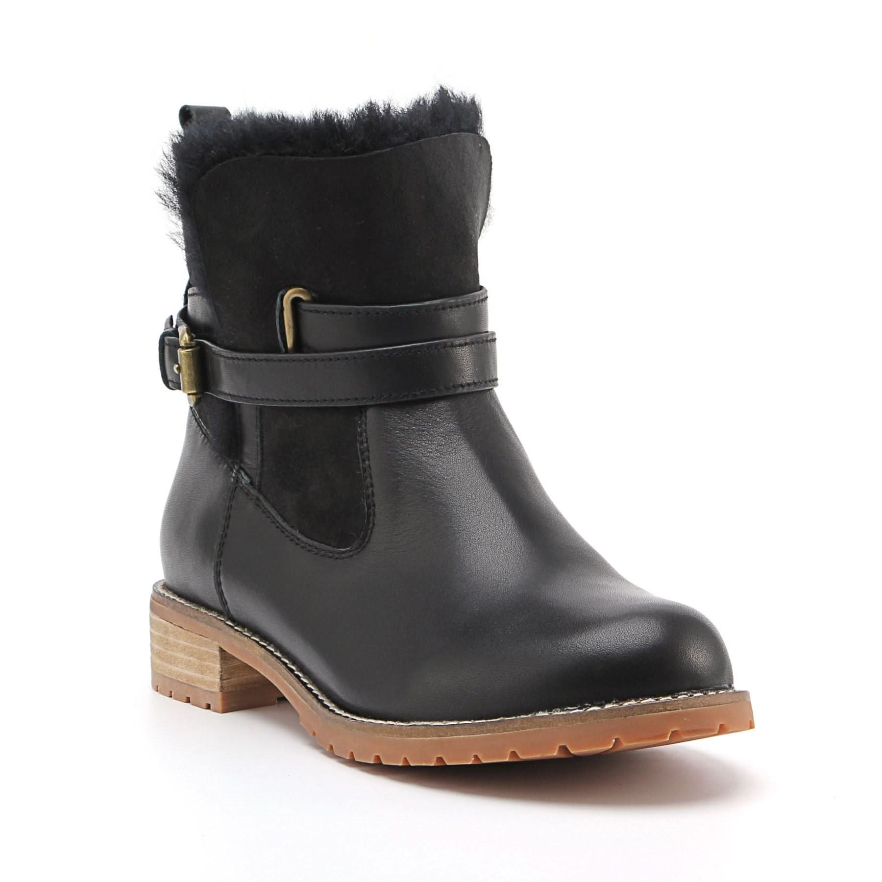 Black sheepskin fur-lined ankle boot with tan lug sole, side view. - Yellow Earth Australia