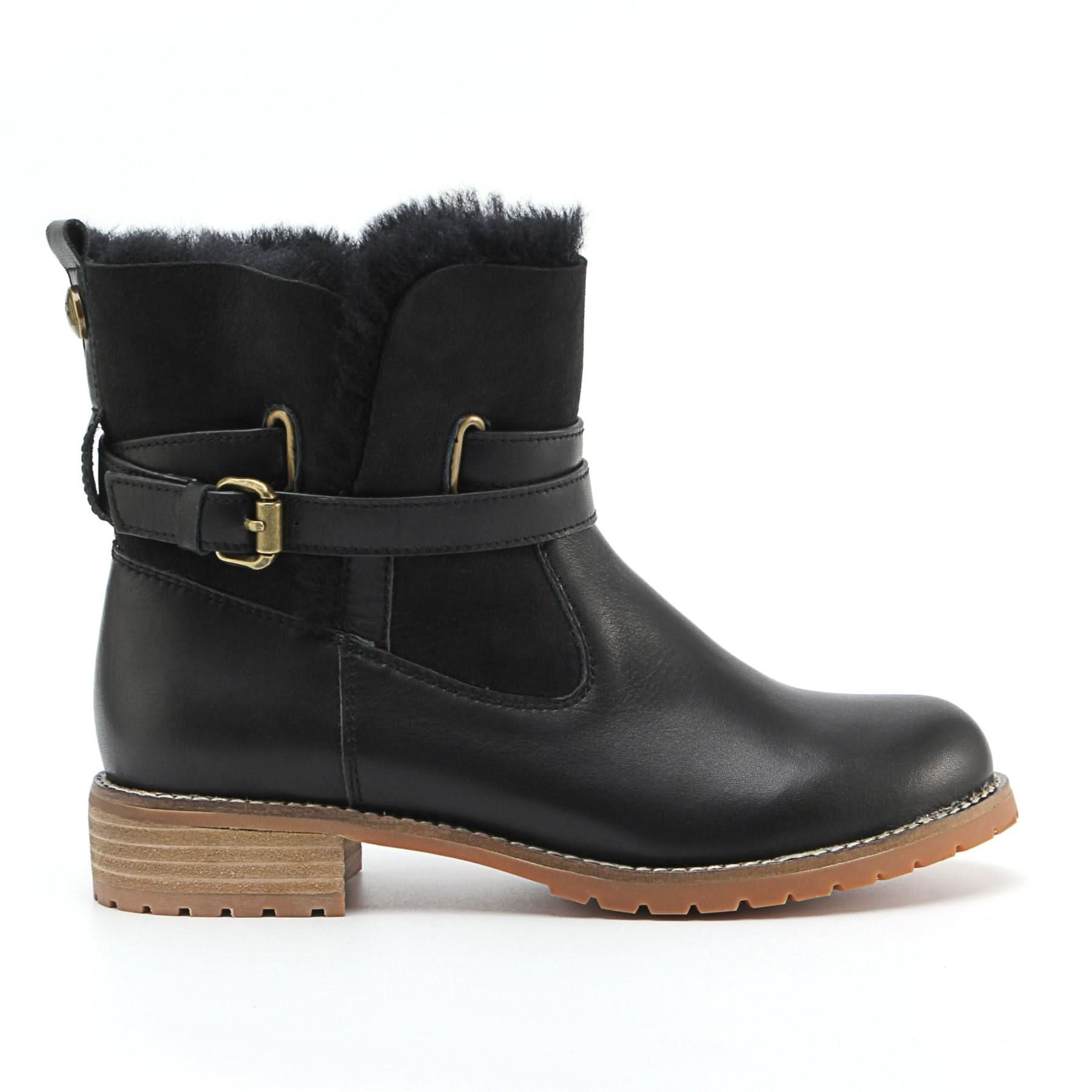 Black sheepskin boot with fur lining and buckle strap, side view. - Yellow Earth Australia