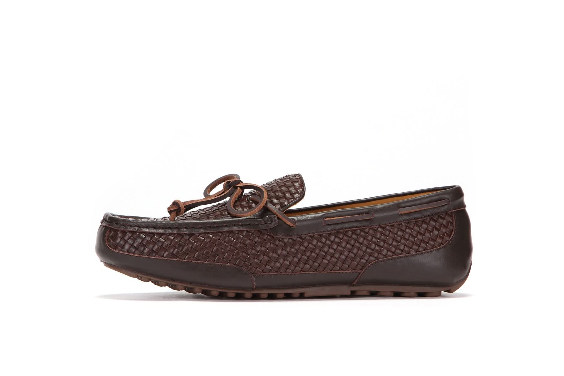 Men's brown woven leather moccasin with bow detail, casual slip-on shoe on white background