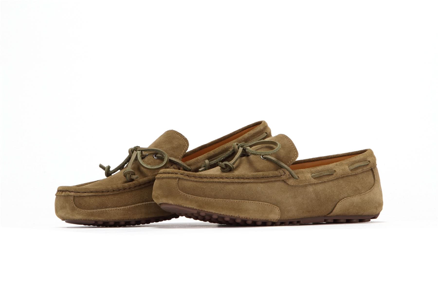 Men's suede moccasin slippers in tan with lace detail and rubber grip sole, side view
