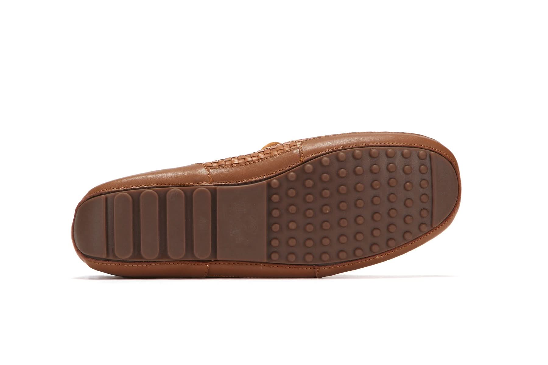 Brown leather moccasin sole with textured grip pattern, bottom view. - Yellow Earth Australia