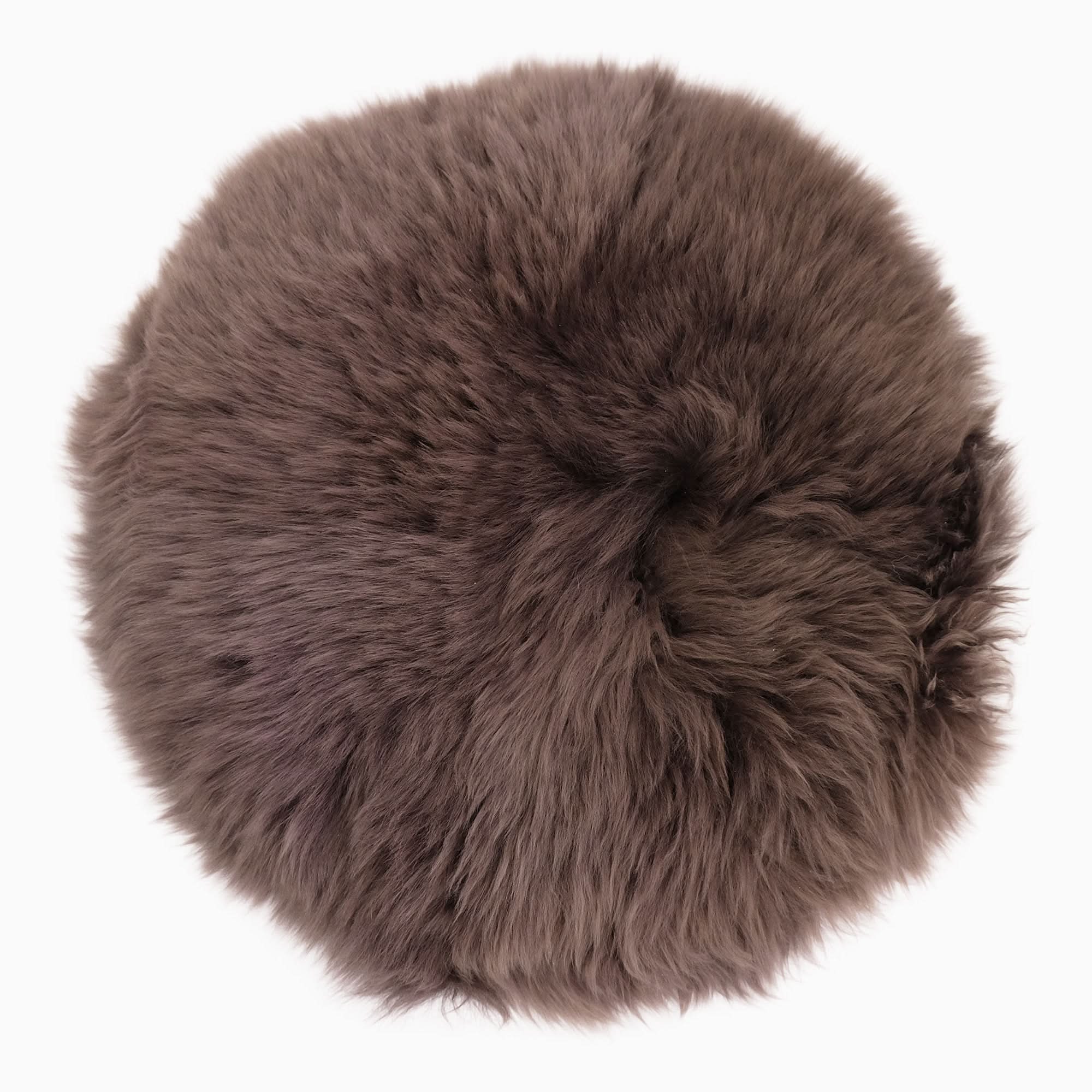 Taupe sheepskin rug with fluffy wool pile, top-down view on white background. - Yellow Earth Australia